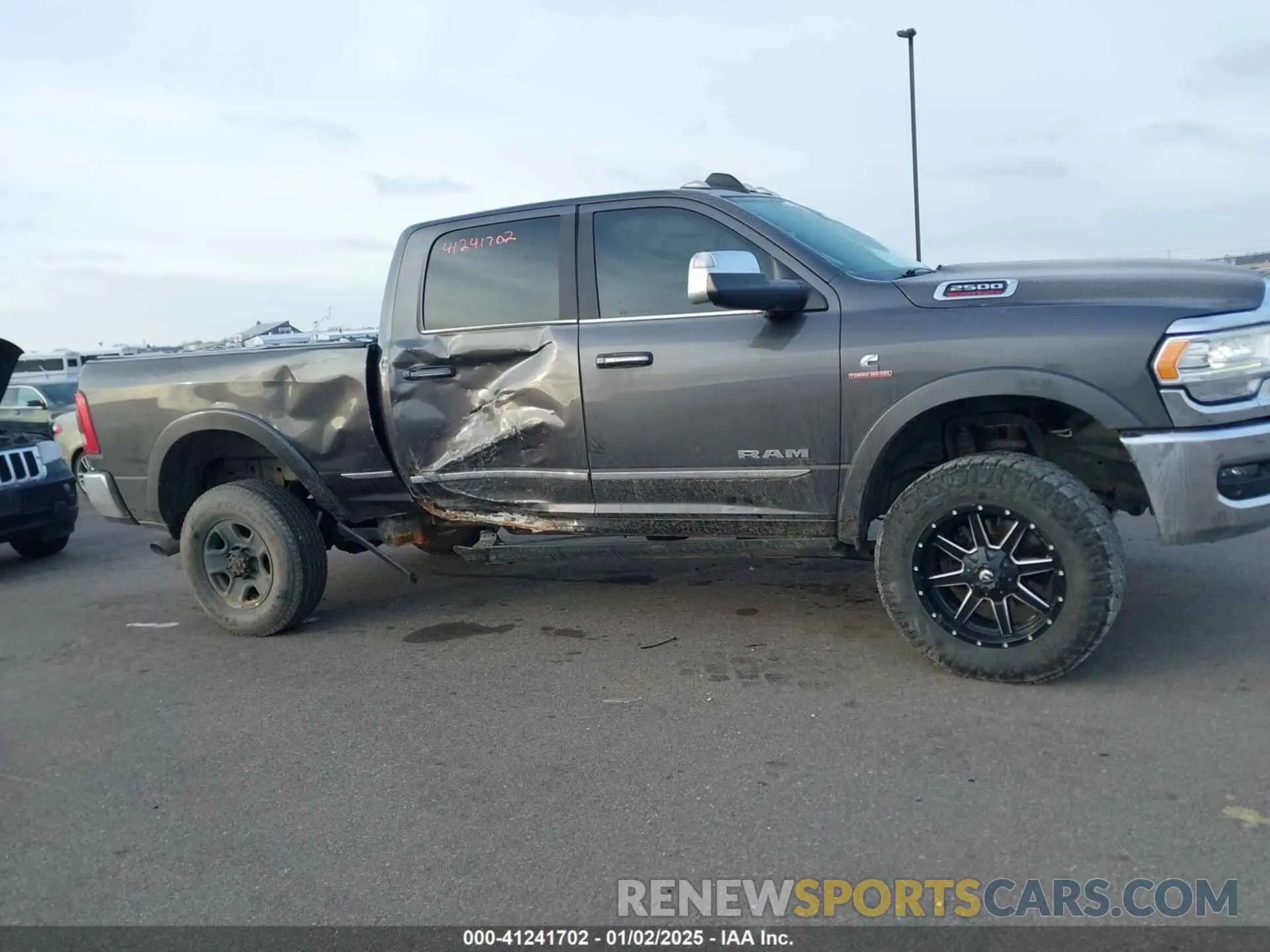 13 Photograph of a damaged car 3C6UR5SL8KG516995 RAM 2500 2019
