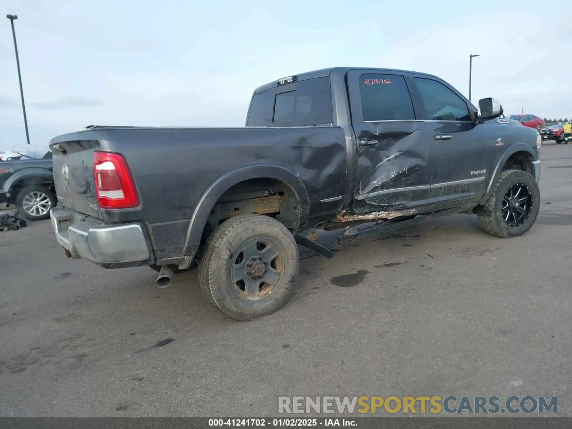 4 Photograph of a damaged car 3C6UR5SL8KG516995 RAM 2500 2019