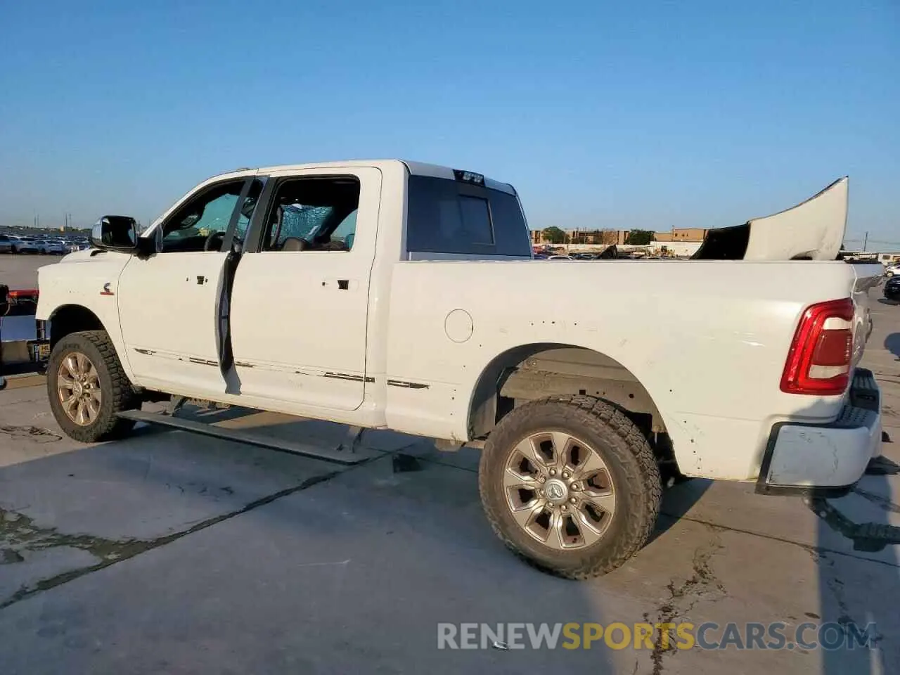 2 Photograph of a damaged car 3C6UR5SL9KG656991 RAM 2500 2019