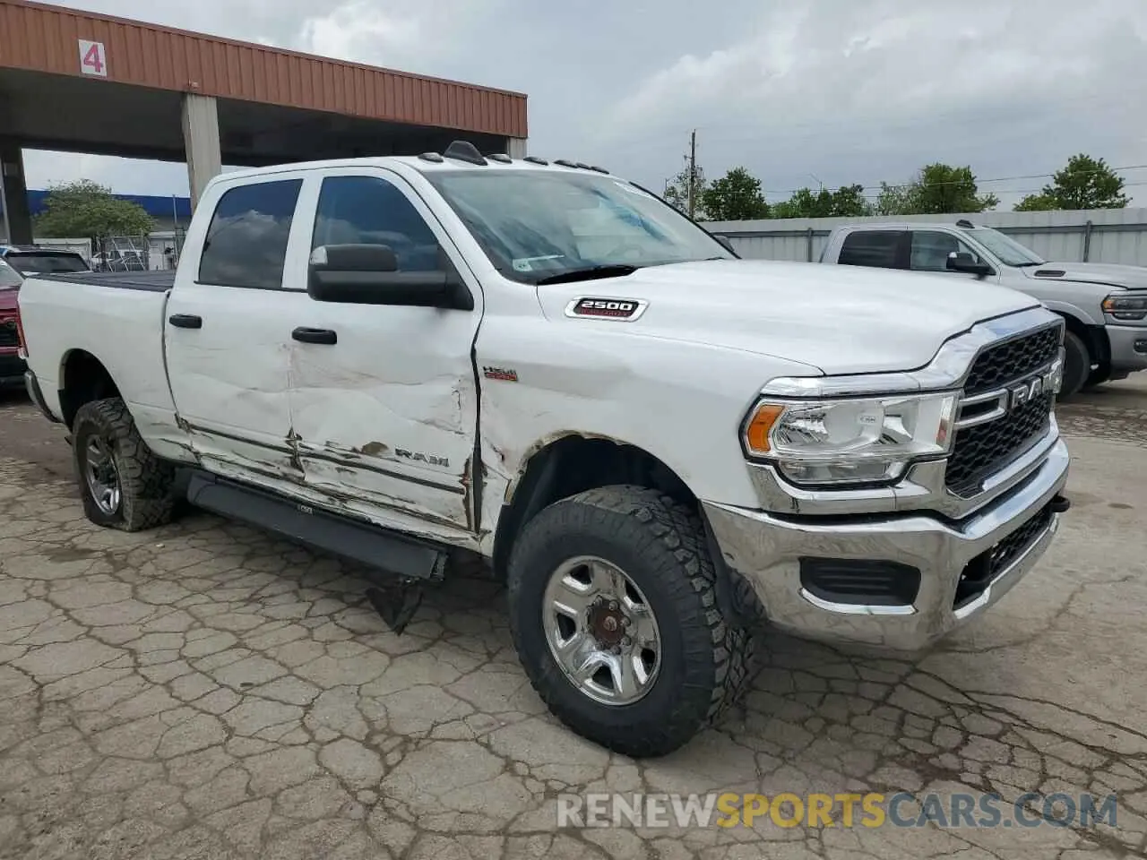 4 Photograph of a damaged car 3C6UR5CJ0LG213966 RAM 2500 2020