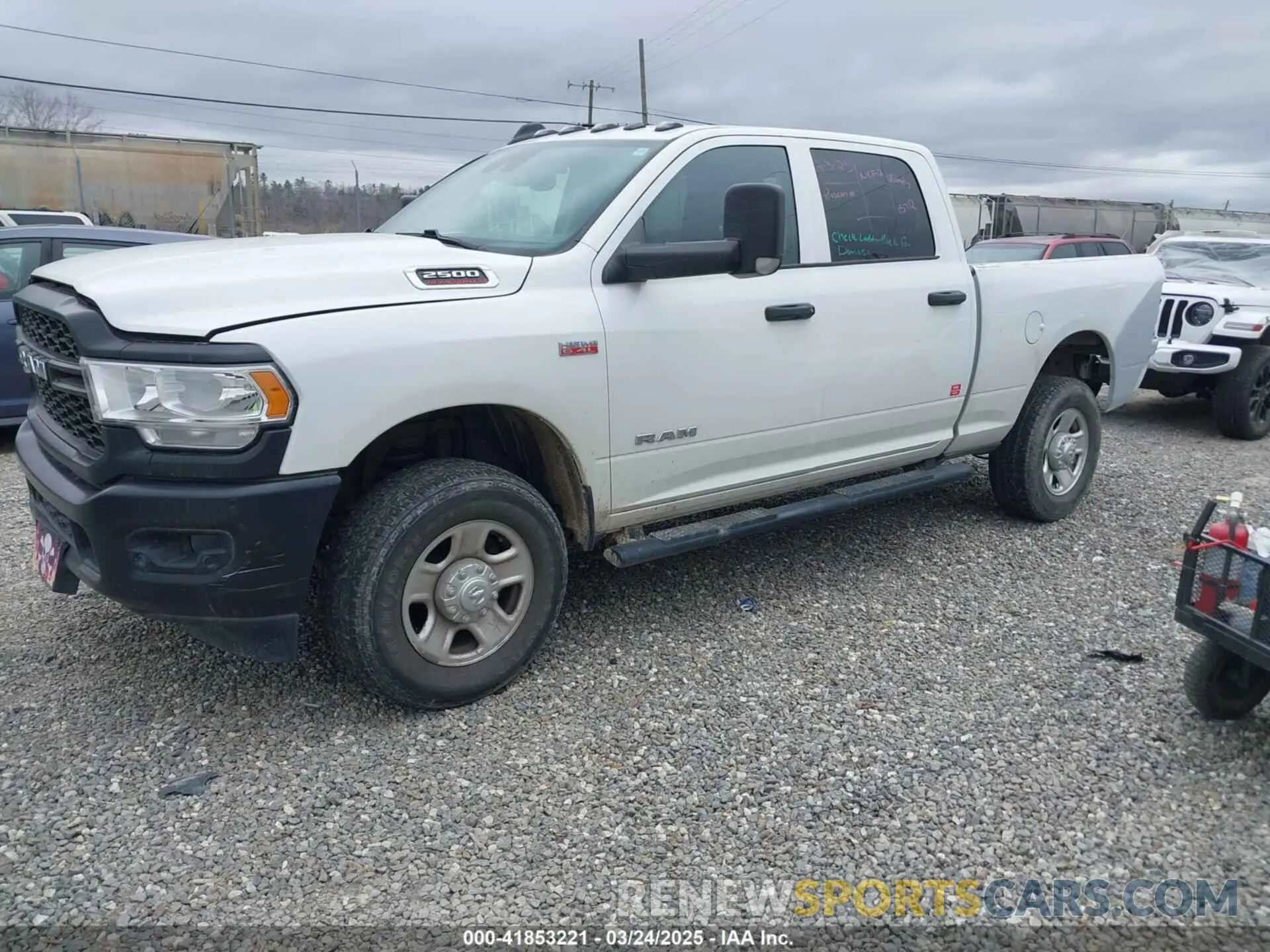 2 Photograph of a damaged car 3C6UR5CJ4LG272647 RAM 2500 2020