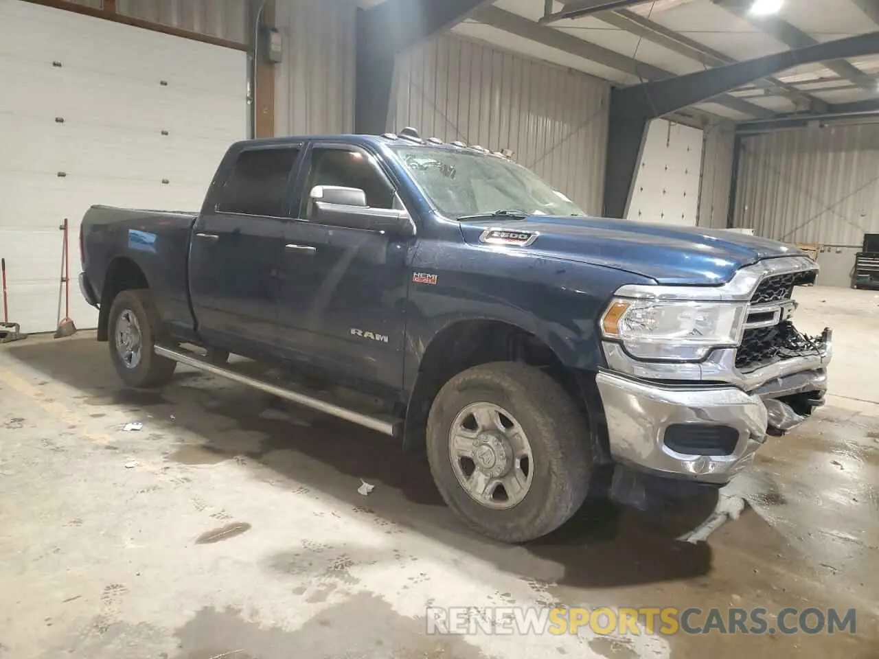 4 Photograph of a damaged car 3C6UR5CJ6LG256594 RAM 2500 2020
