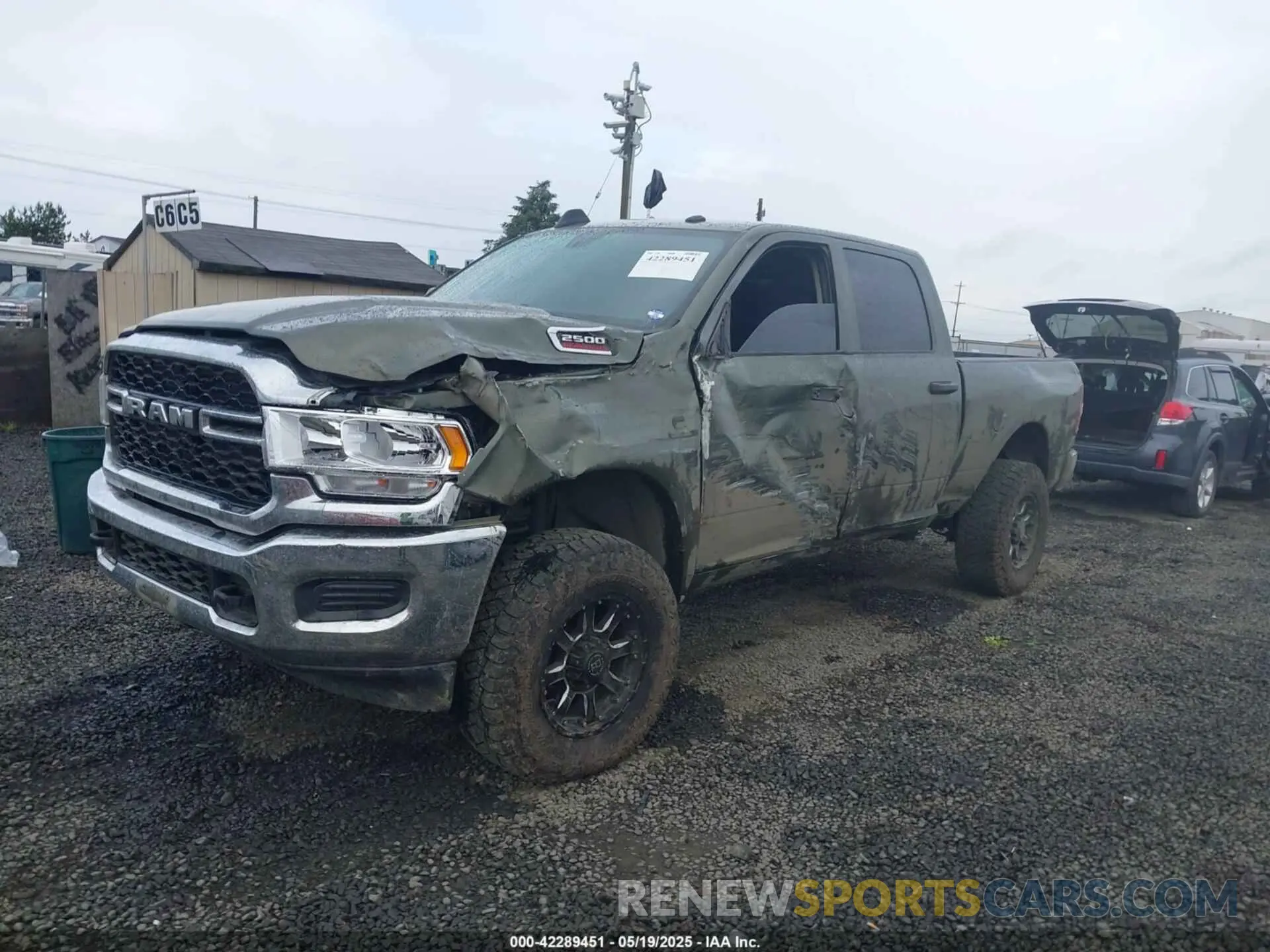 2 Photograph of a damaged car 3C6UR5CL1LG308828 RAM 2500 2020