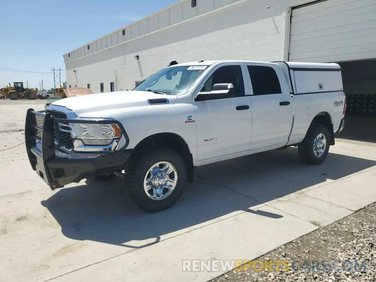 1 Photograph of a damaged car 3C6UR5CL3LG285715 RAM 2500 2020