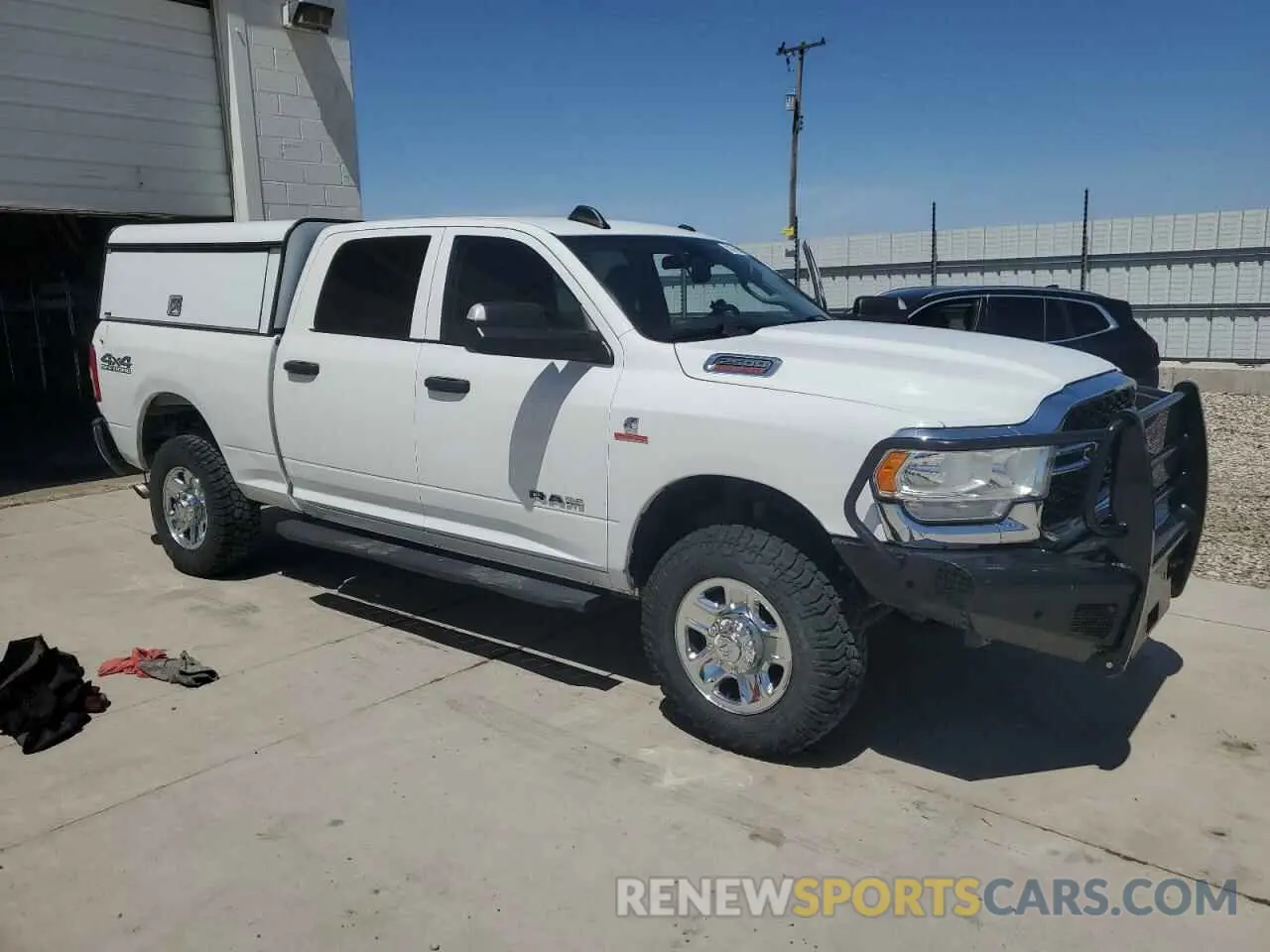 4 Photograph of a damaged car 3C6UR5CL3LG285715 RAM 2500 2020