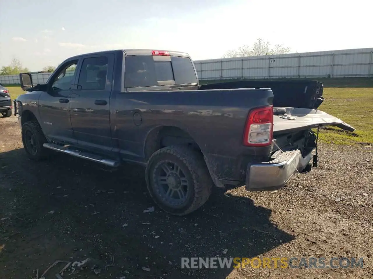 2 Photograph of a damaged car 3C6UR5CL7LG280954 RAM 2500 2020