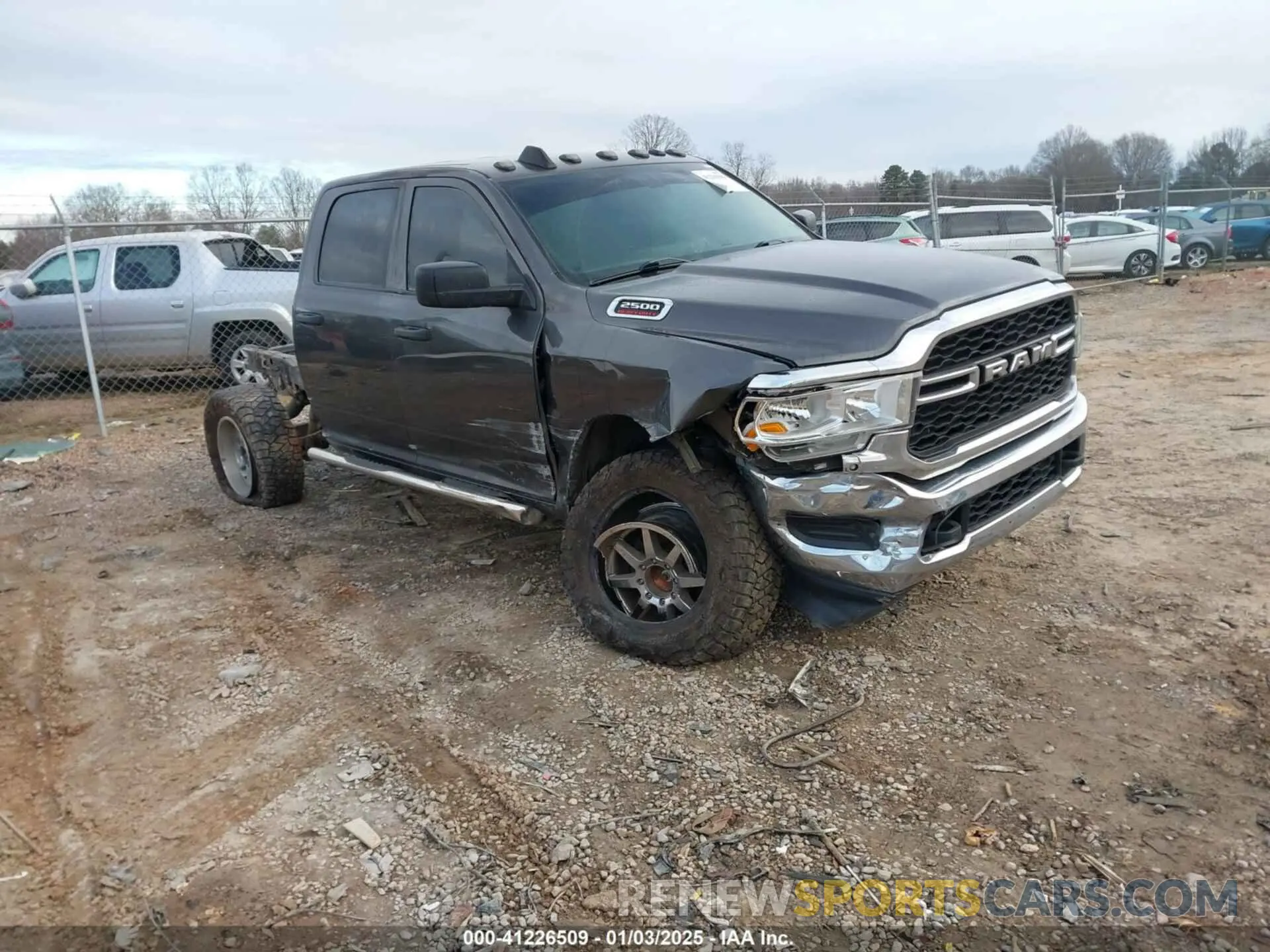 1 Photograph of a damaged car 3C6UR5CL9LG123989 RAM 2500 2020