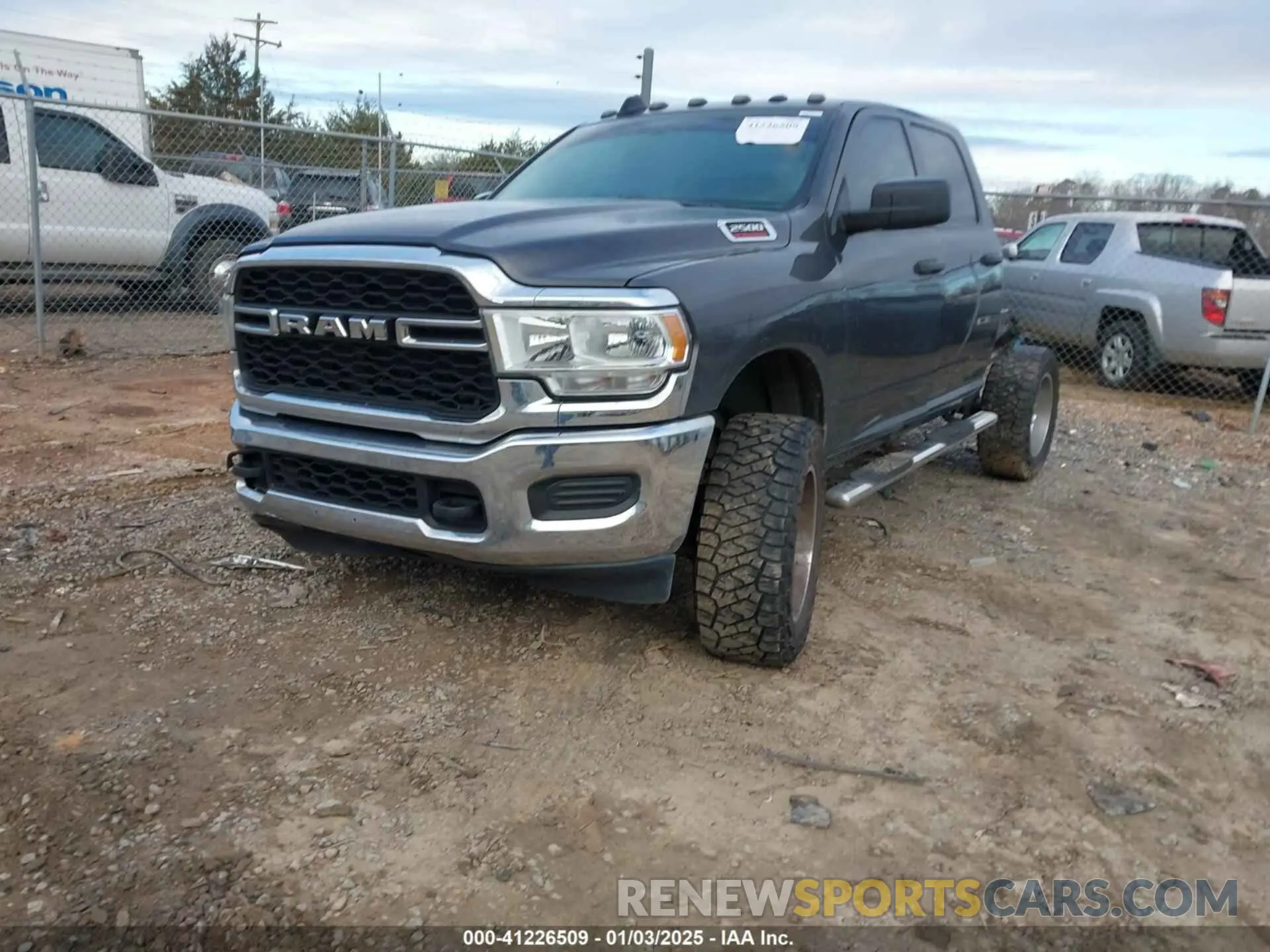 2 Photograph of a damaged car 3C6UR5CL9LG123989 RAM 2500 2020