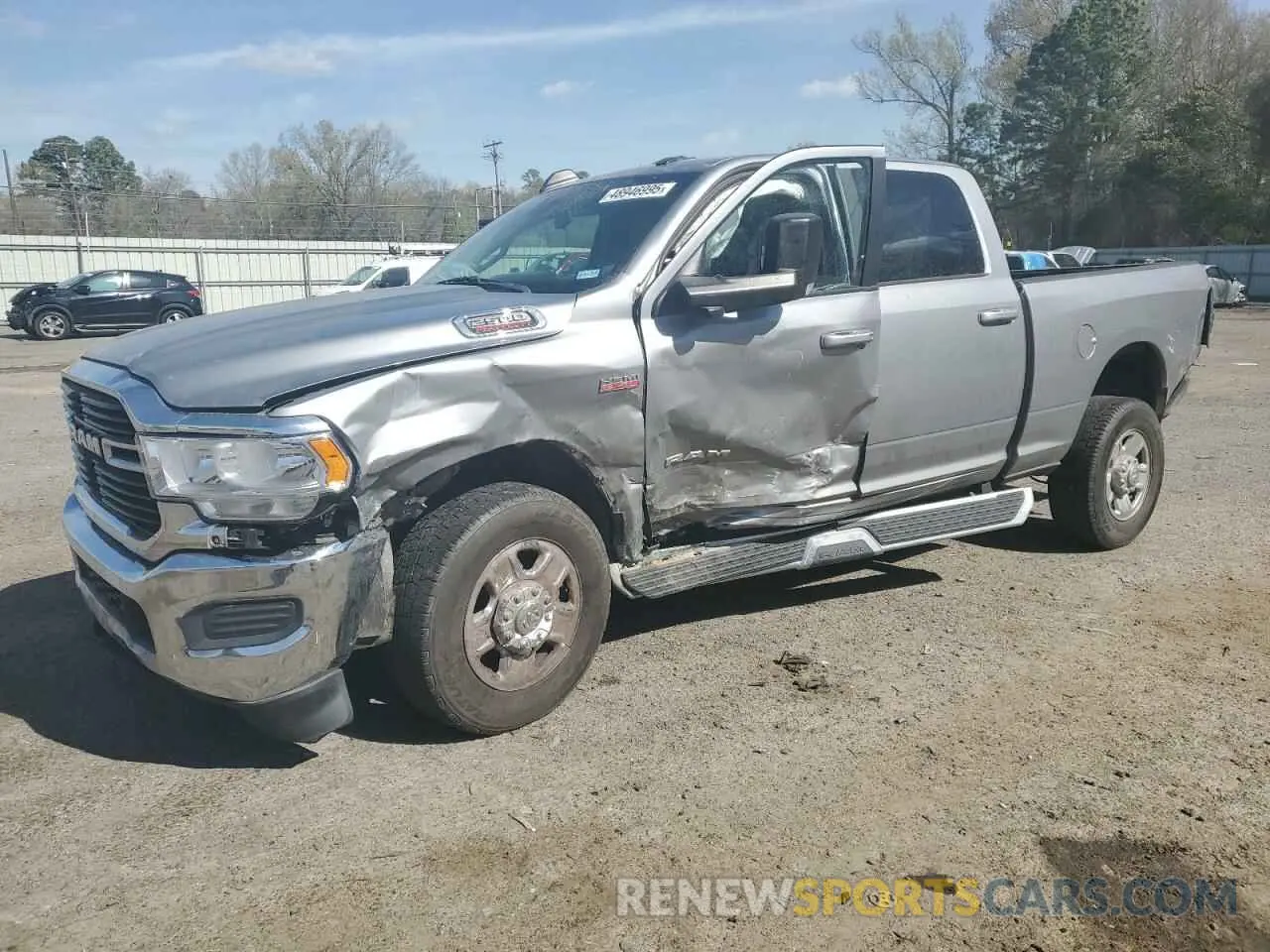 1 Photograph of a damaged car 3C6UR5DJ2LG297531 RAM 2500 2020