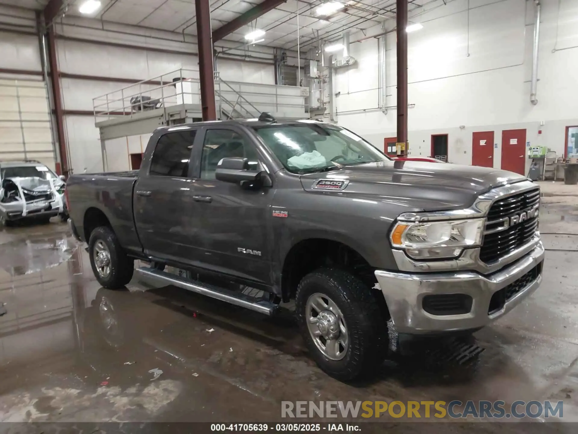 1 Photograph of a damaged car 3C6UR5DJ8LG298134 RAM 2500 2020