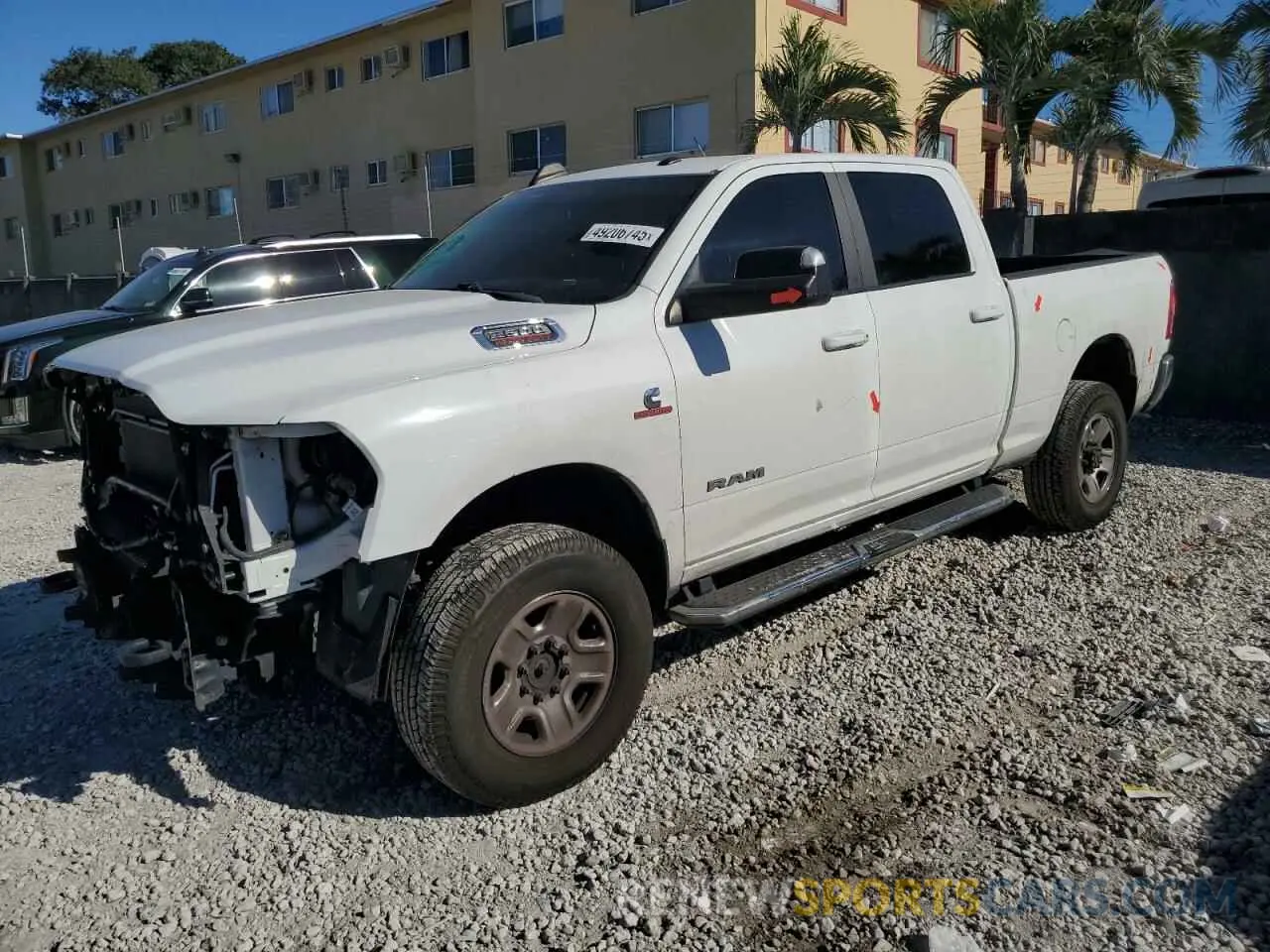 1 Photograph of a damaged car 3C6UR5DL0LG132708 RAM 2500 2020
