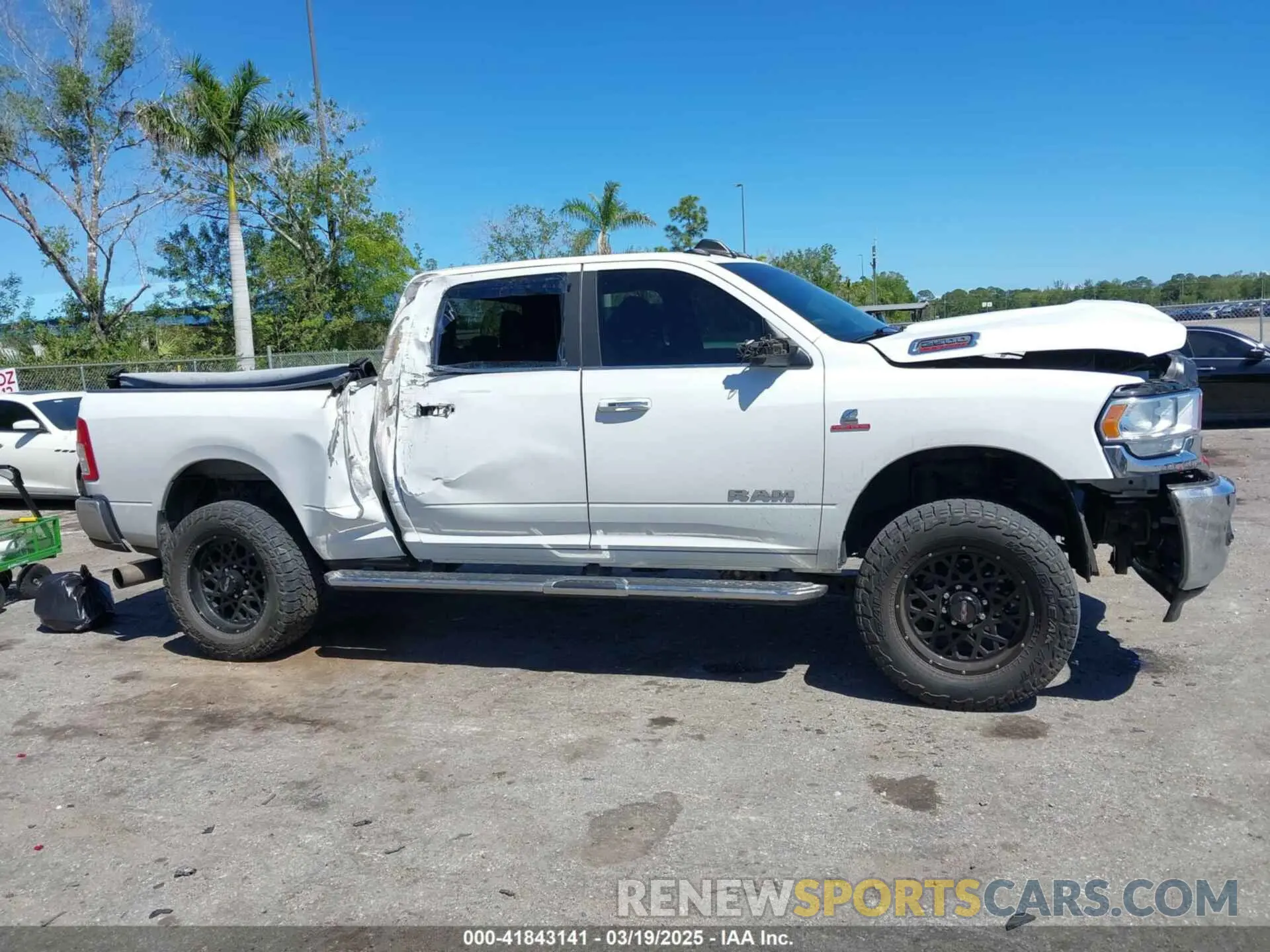 13 Photograph of a damaged car 3C6UR5DL3LG309803 RAM 2500 2020