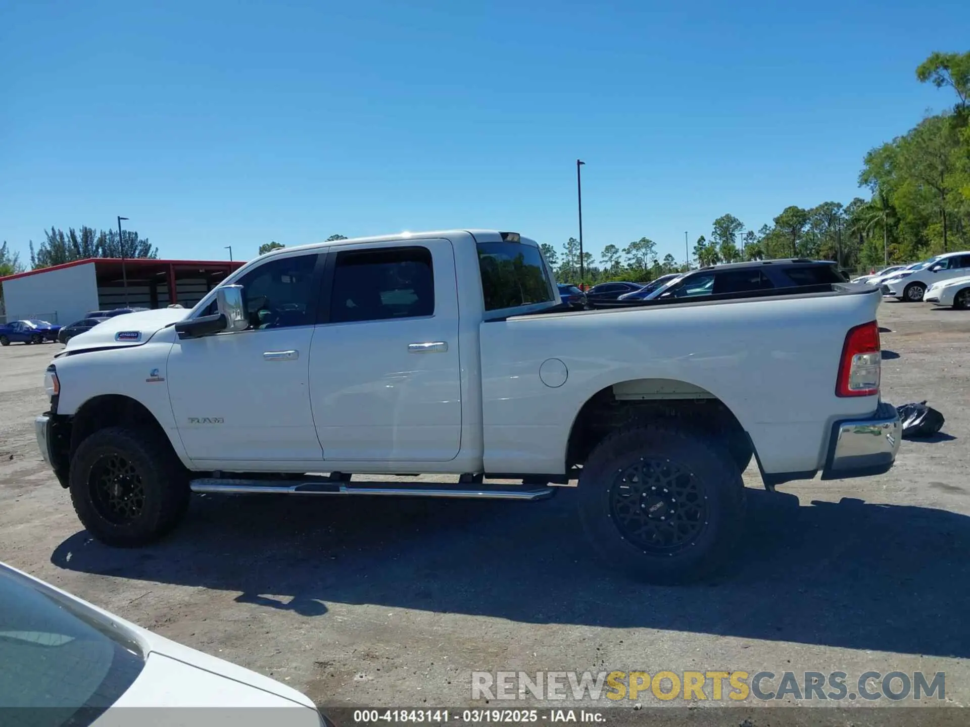 14 Photograph of a damaged car 3C6UR5DL3LG309803 RAM 2500 2020
