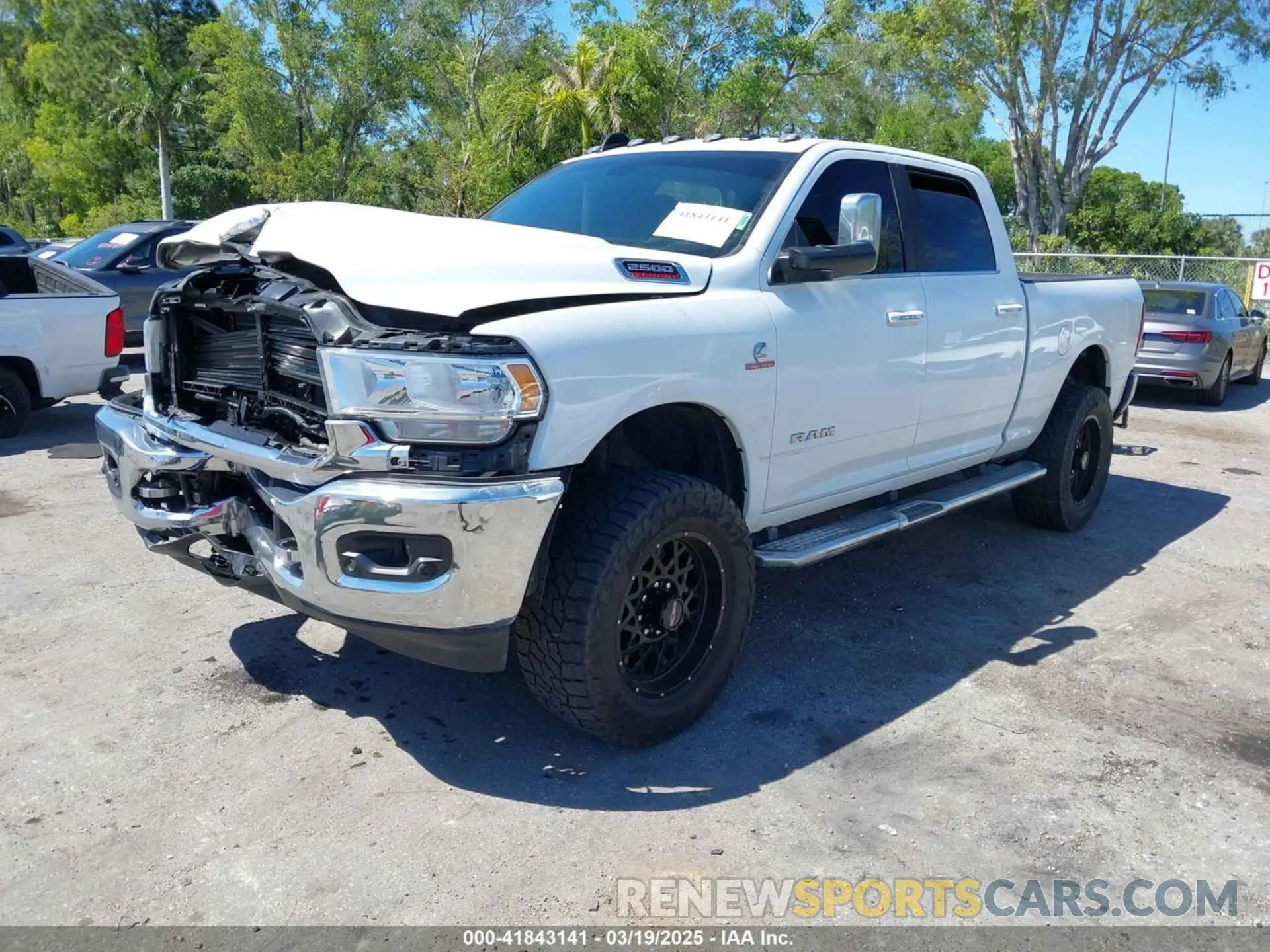 2 Photograph of a damaged car 3C6UR5DL3LG309803 RAM 2500 2020