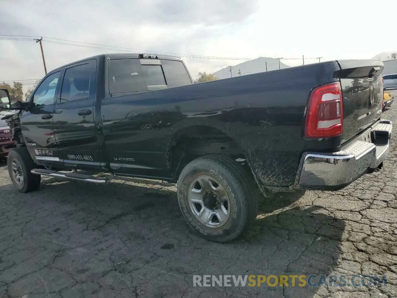 2 Photograph of a damaged car 3C6UR5HLXLG163135 RAM 2500 2020