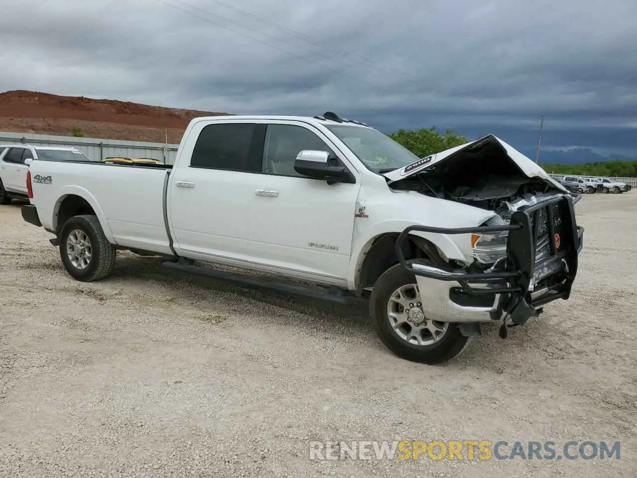4 Photograph of a damaged car 3C6UR5KL9LG111522 RAM 2500 2020