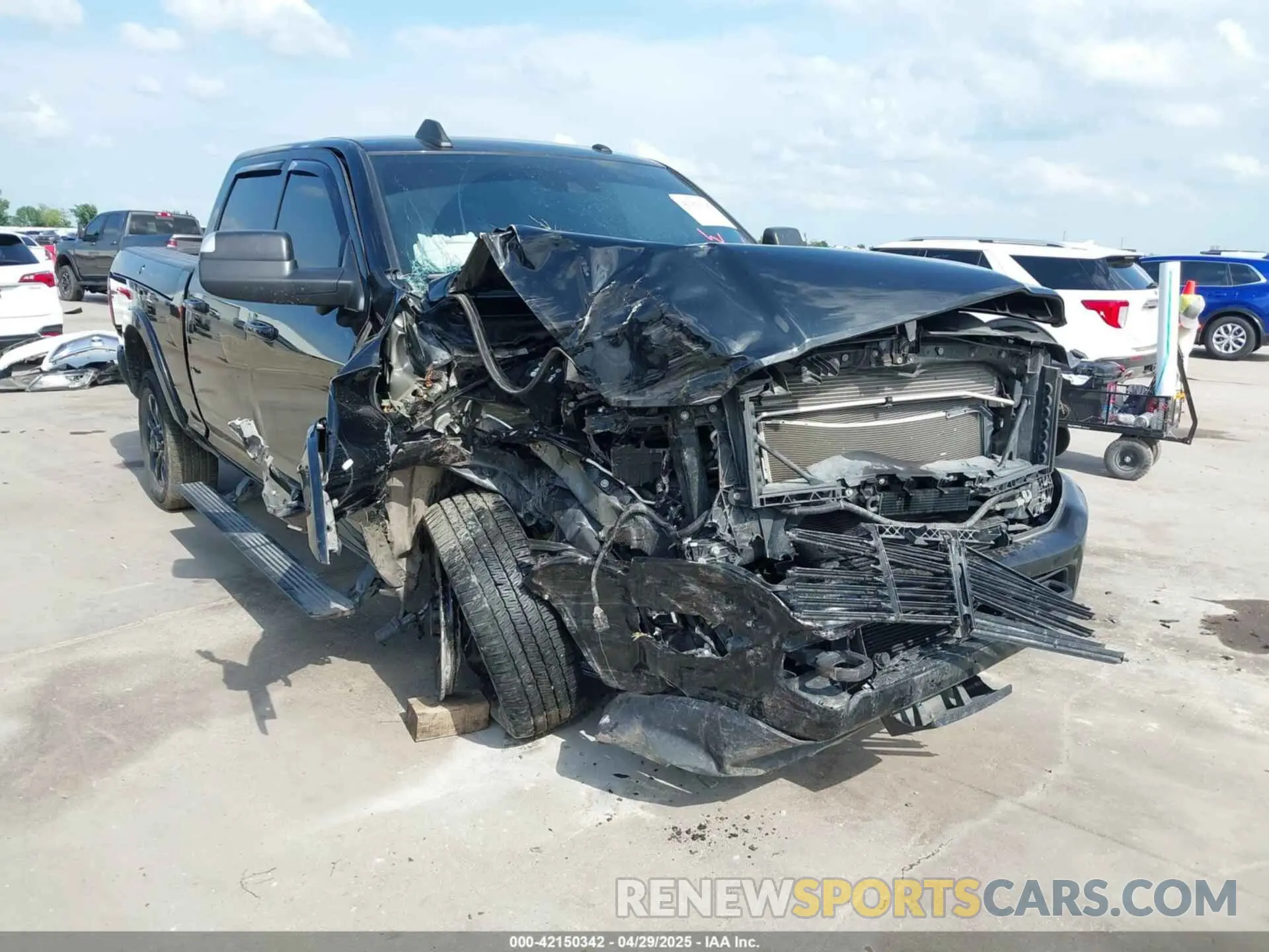1 Photograph of a damaged car 3C6UR5SL1LG213509 RAM 2500 2020