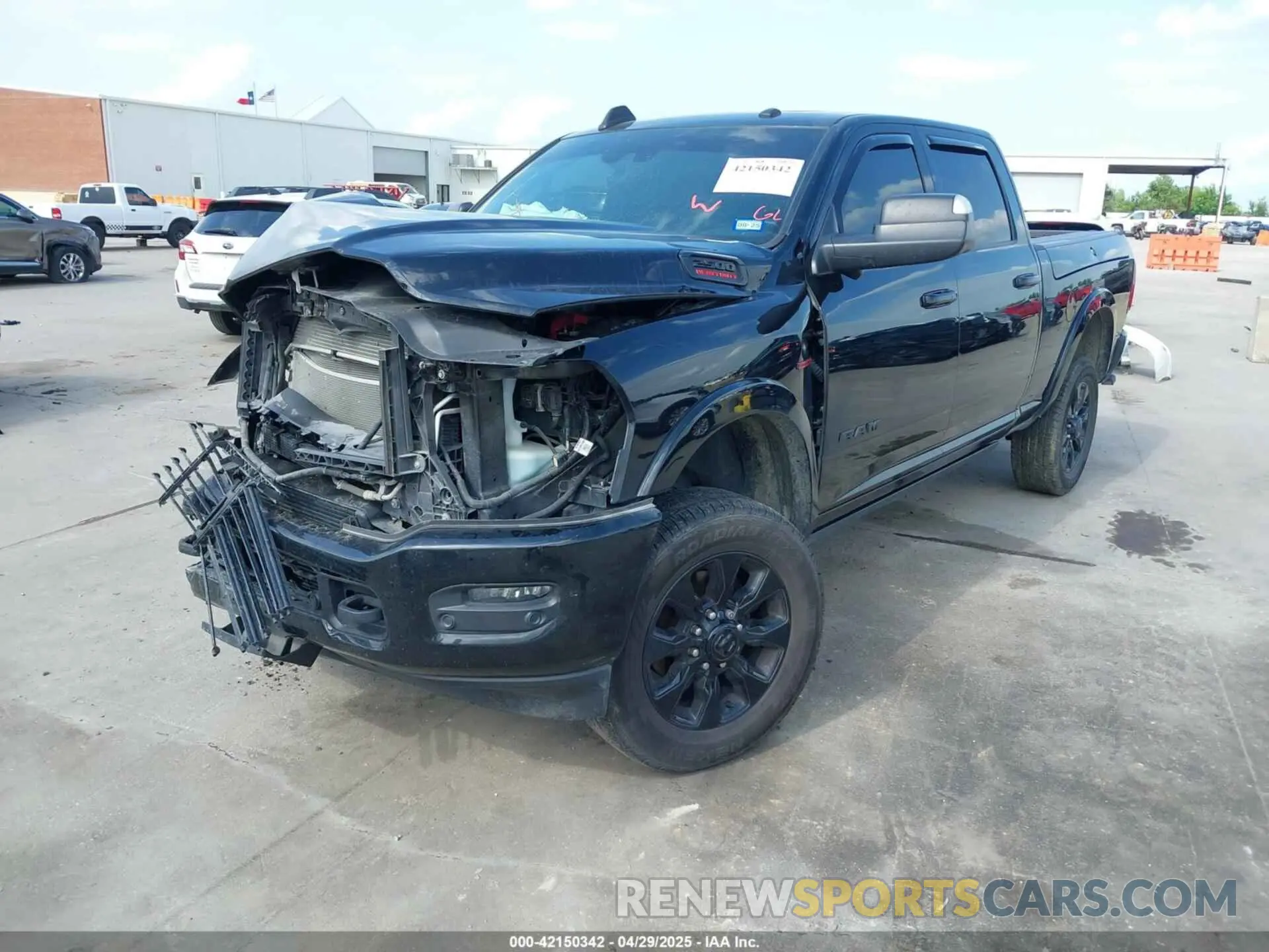 2 Photograph of a damaged car 3C6UR5SL1LG213509 RAM 2500 2020