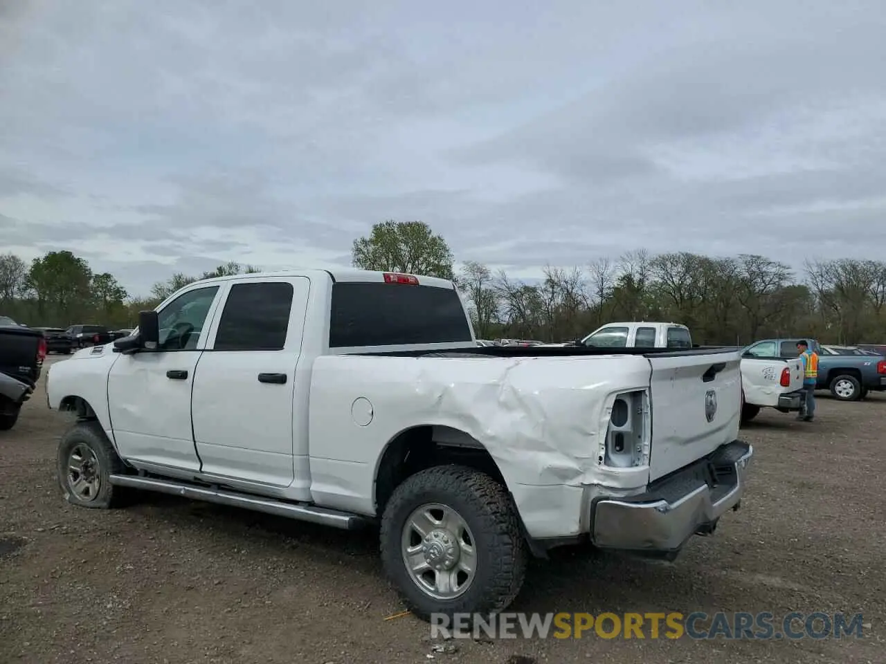 2 Photograph of a damaged car 3C6UR5CJ2MG558658 RAM 2500 2021