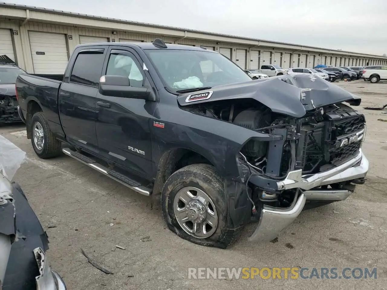 4 Photograph of a damaged car 3C6UR5CJ2MG561219 RAM 2500 2021