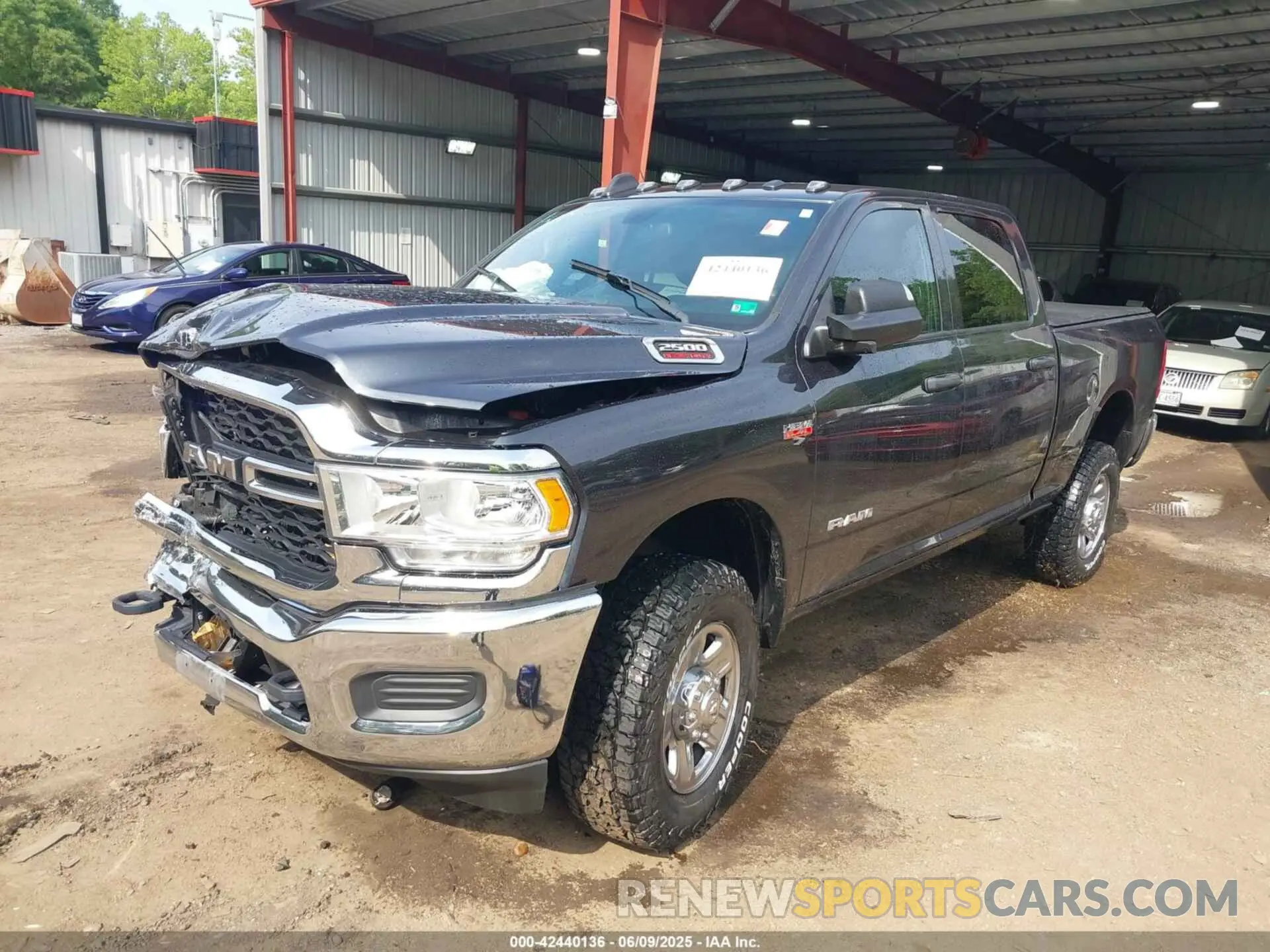 2 Photograph of a damaged car 3C6UR5CJ3MG697813 RAM 2500 2021