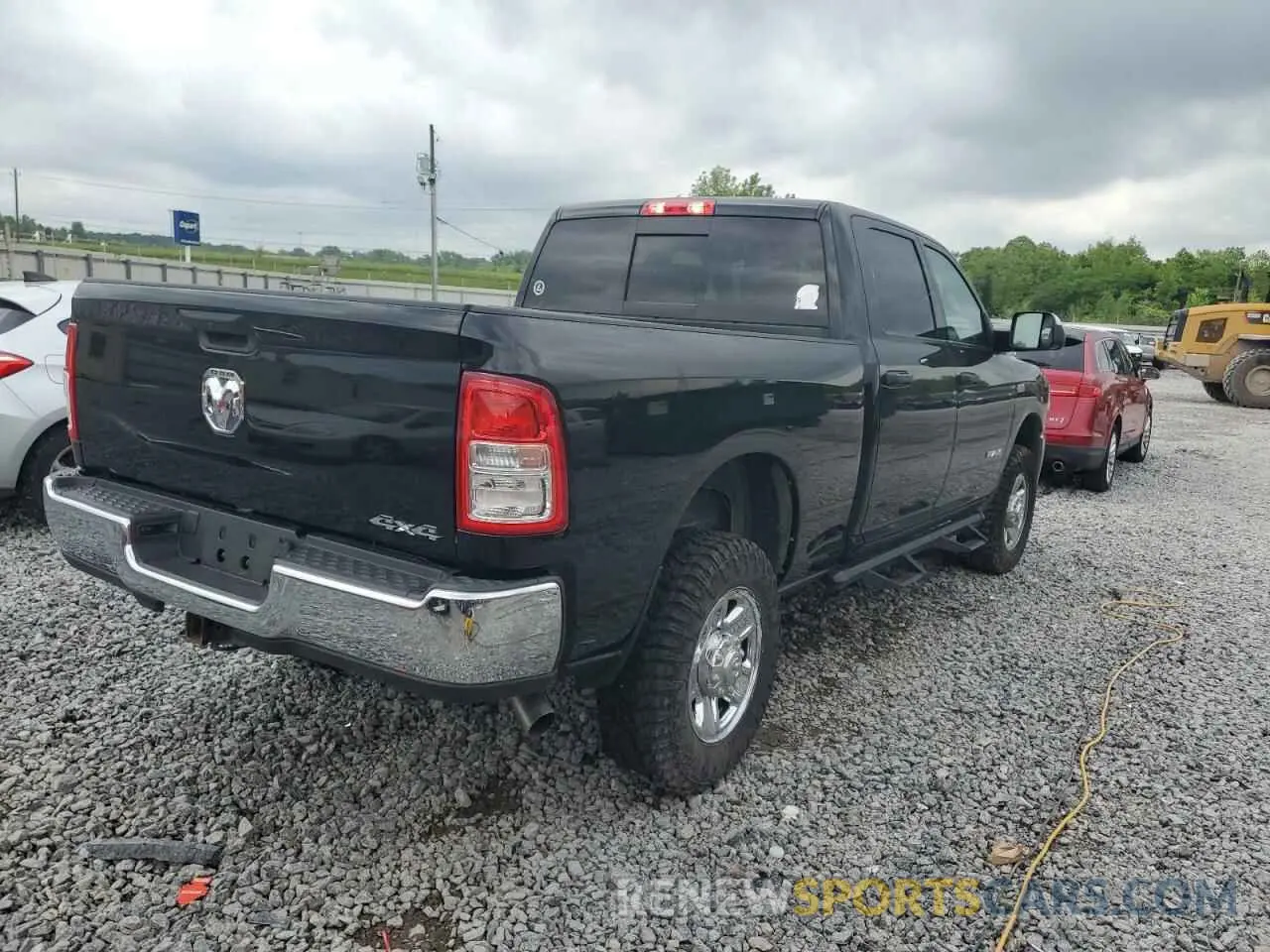 3 Photograph of a damaged car 3C6UR5CJ6MG695991 RAM 2500 2021
