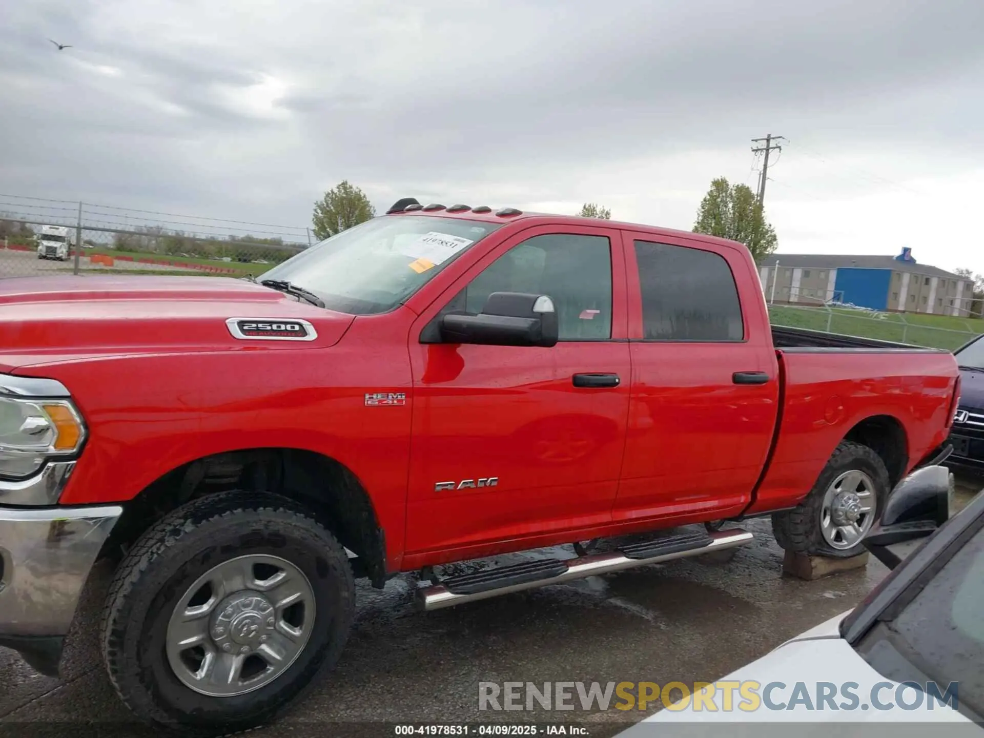 14 Photograph of a damaged car 3C6UR5CJ8MG676276 RAM 2500 2021