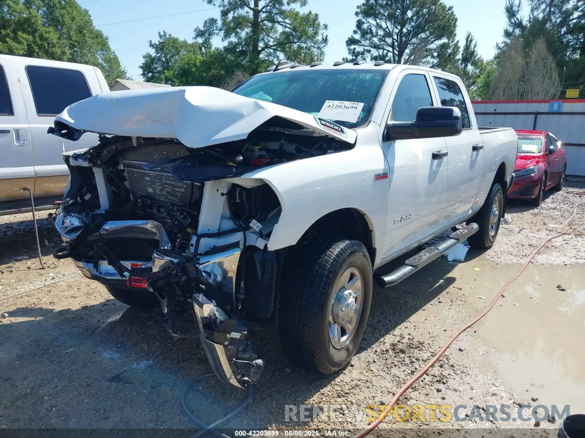 2 Photograph of a damaged car 3C6UR5CJ9MG641813 RAM 2500 2021