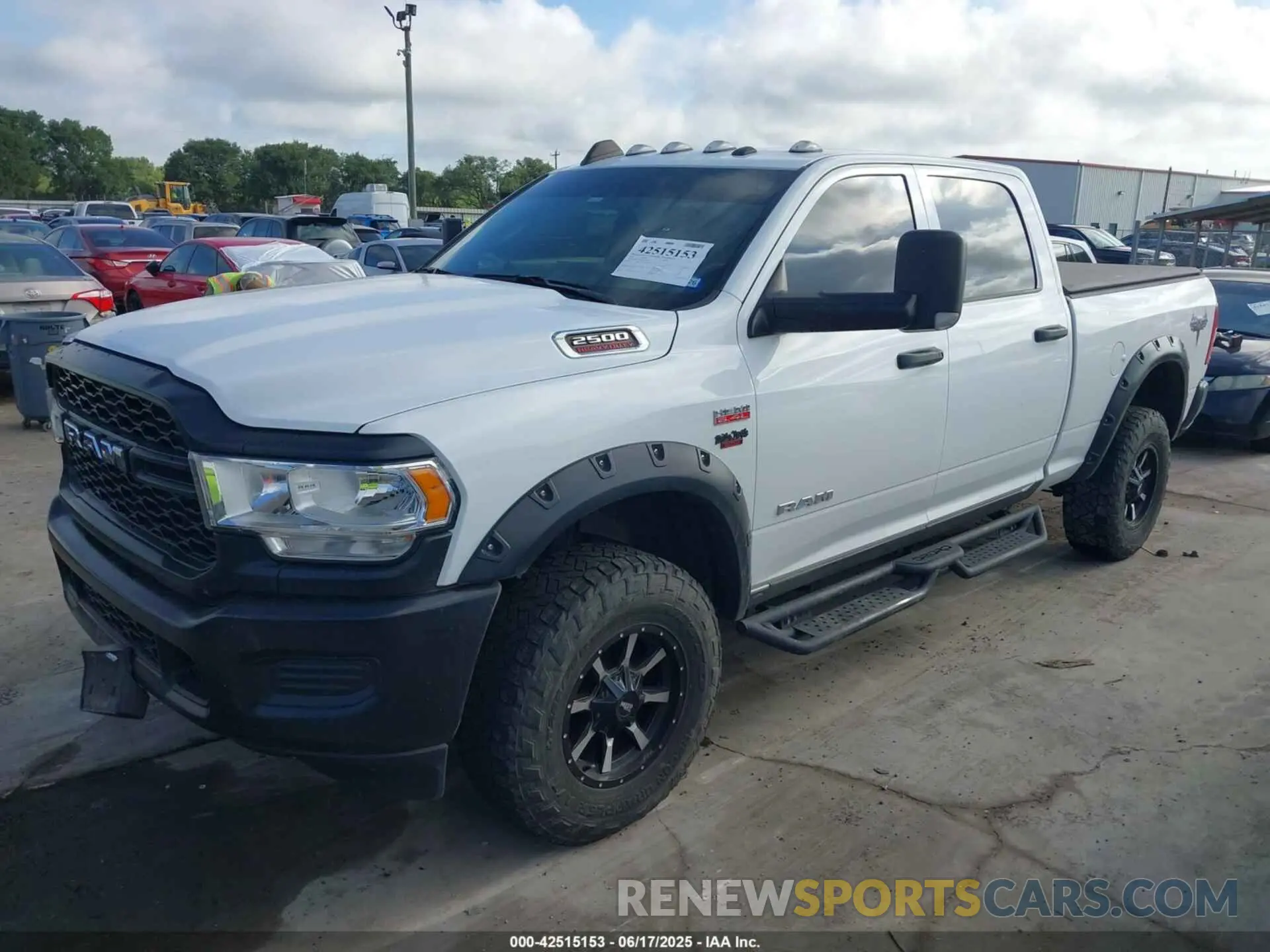 2 Photograph of a damaged car 3C6UR5CJXMG611381 RAM 2500 2021