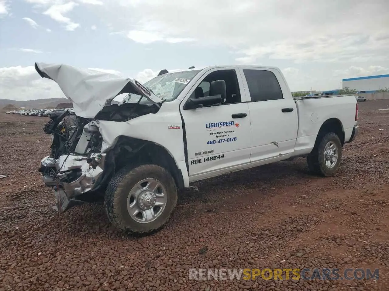 1 Photograph of a damaged car 3C6UR5CJXMG672598 RAM 2500 2021