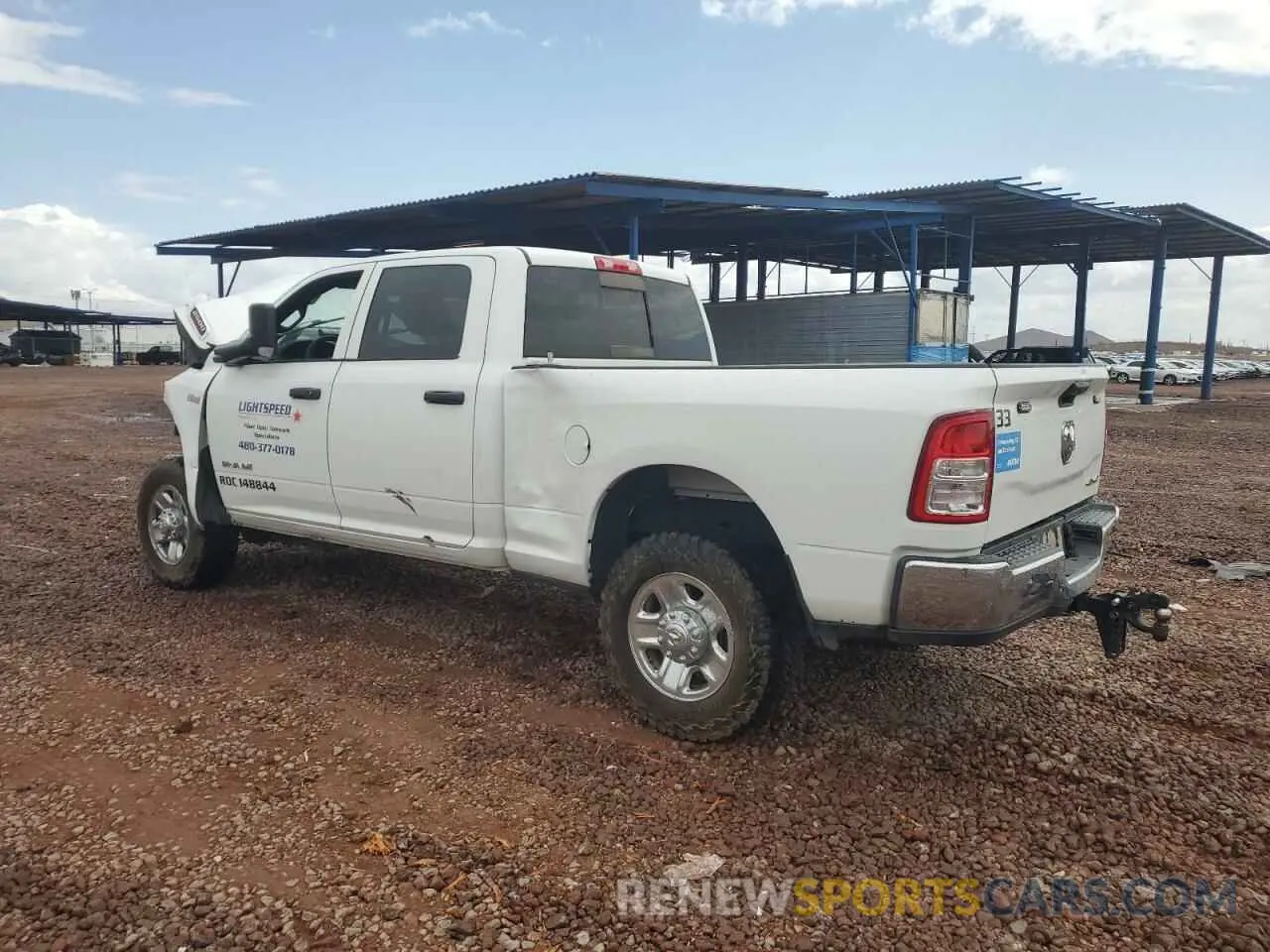 2 Photograph of a damaged car 3C6UR5CJXMG672598 RAM 2500 2021