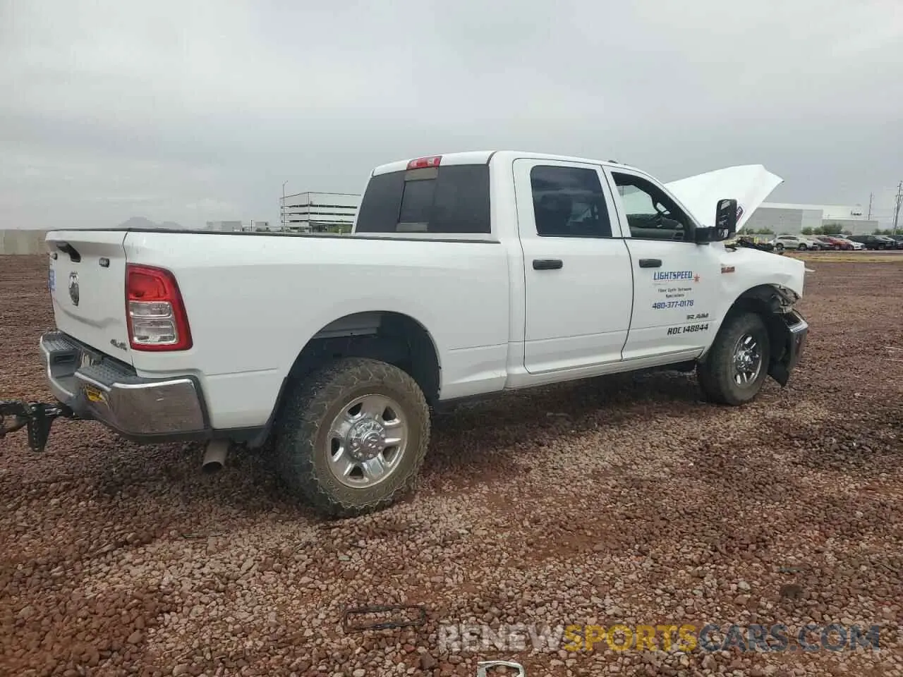 3 Photograph of a damaged car 3C6UR5CJXMG672598 RAM 2500 2021