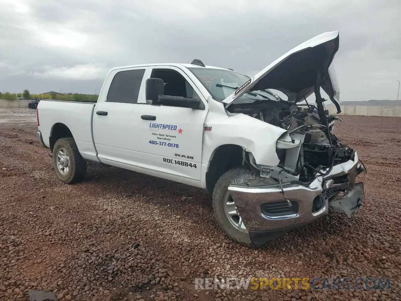 4 Photograph of a damaged car 3C6UR5CJXMG672598 RAM 2500 2021