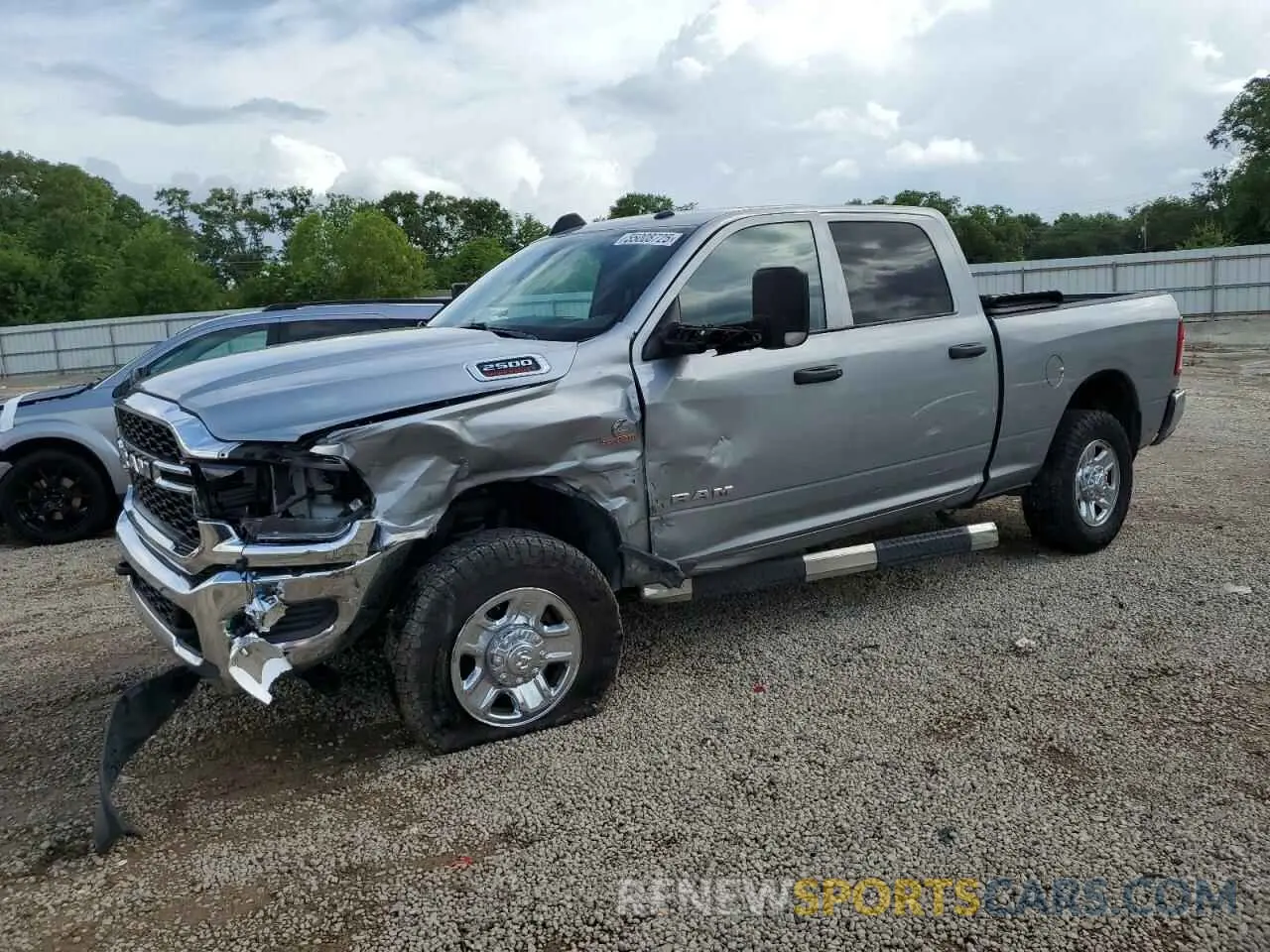 1 Photograph of a damaged car 3C6UR5CL2MG519358 RAM 2500 2021
