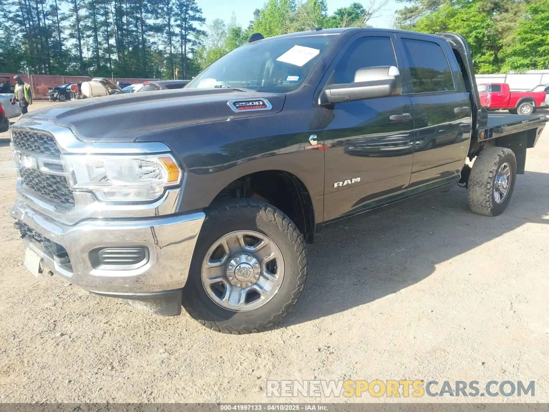 2 Photograph of a damaged car 3C6UR5CL4MG655572 RAM 2500 2021