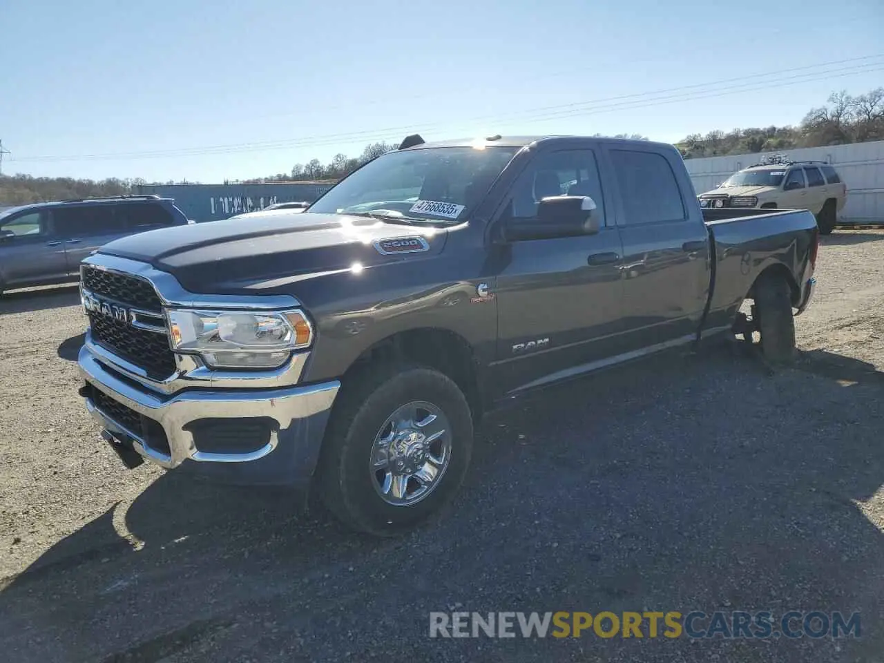 1 Photograph of a damaged car 3C6UR5CL4MG675319 RAM 2500 2021