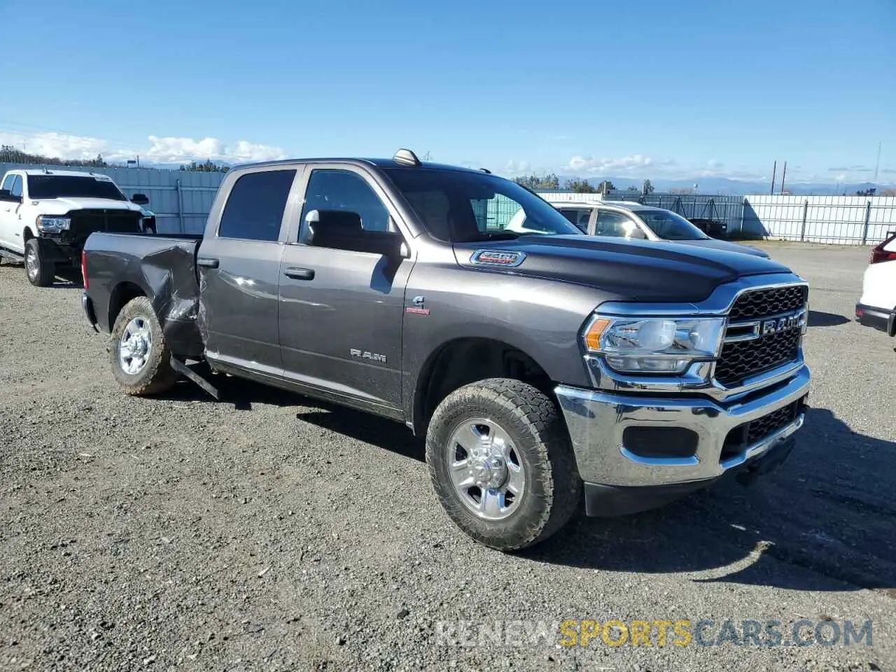 4 Photograph of a damaged car 3C6UR5CL4MG675319 RAM 2500 2021