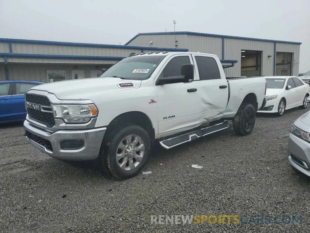 1 Photograph of a damaged car 3C6UR5CL9MG681939 RAM 2500 2021