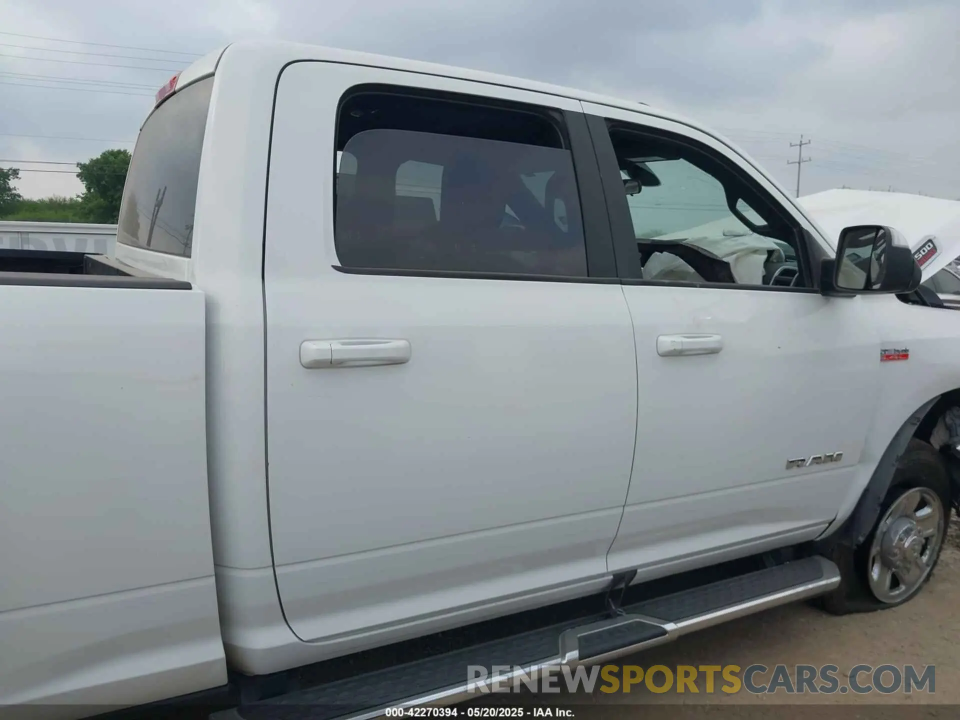 13 Photograph of a damaged car 3C6UR5DJ2MG674585 RAM 2500 2021