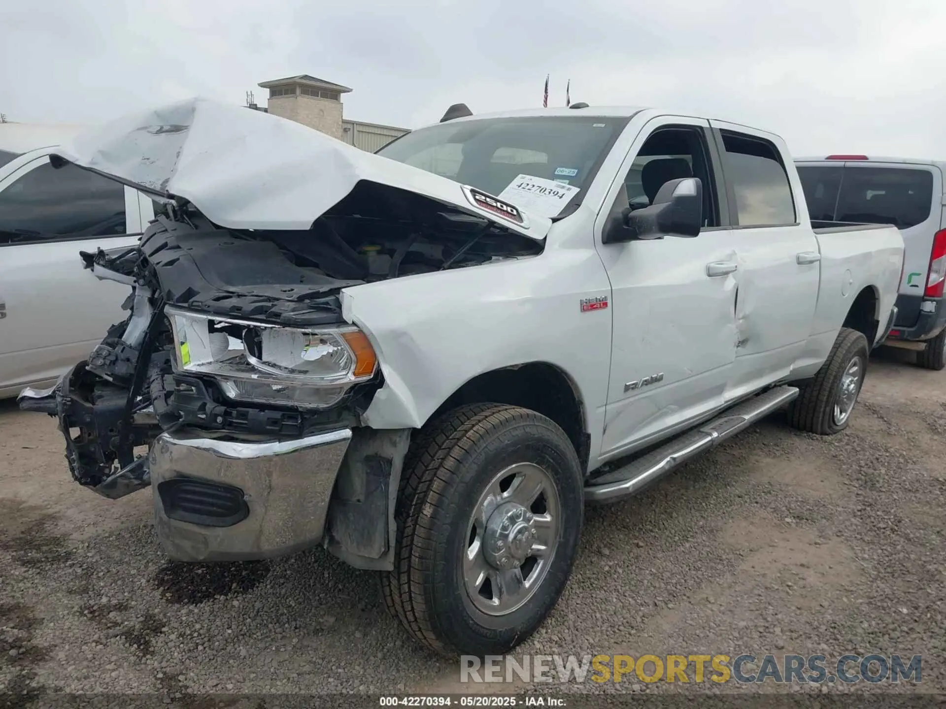 2 Photograph of a damaged car 3C6UR5DJ2MG674585 RAM 2500 2021