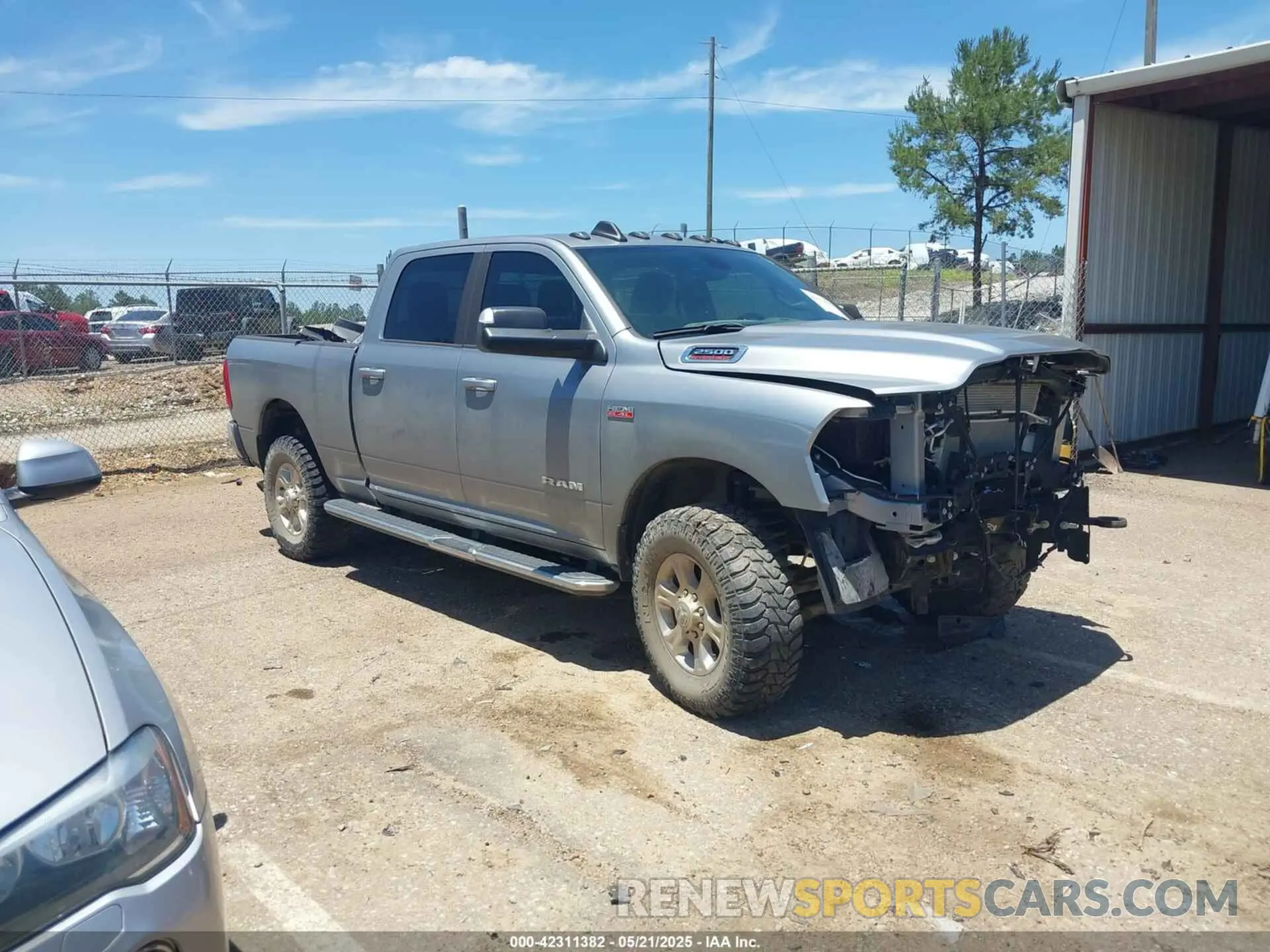1 Photograph of a damaged car 3C6UR5DJ9MG590554 RAM 2500 2021