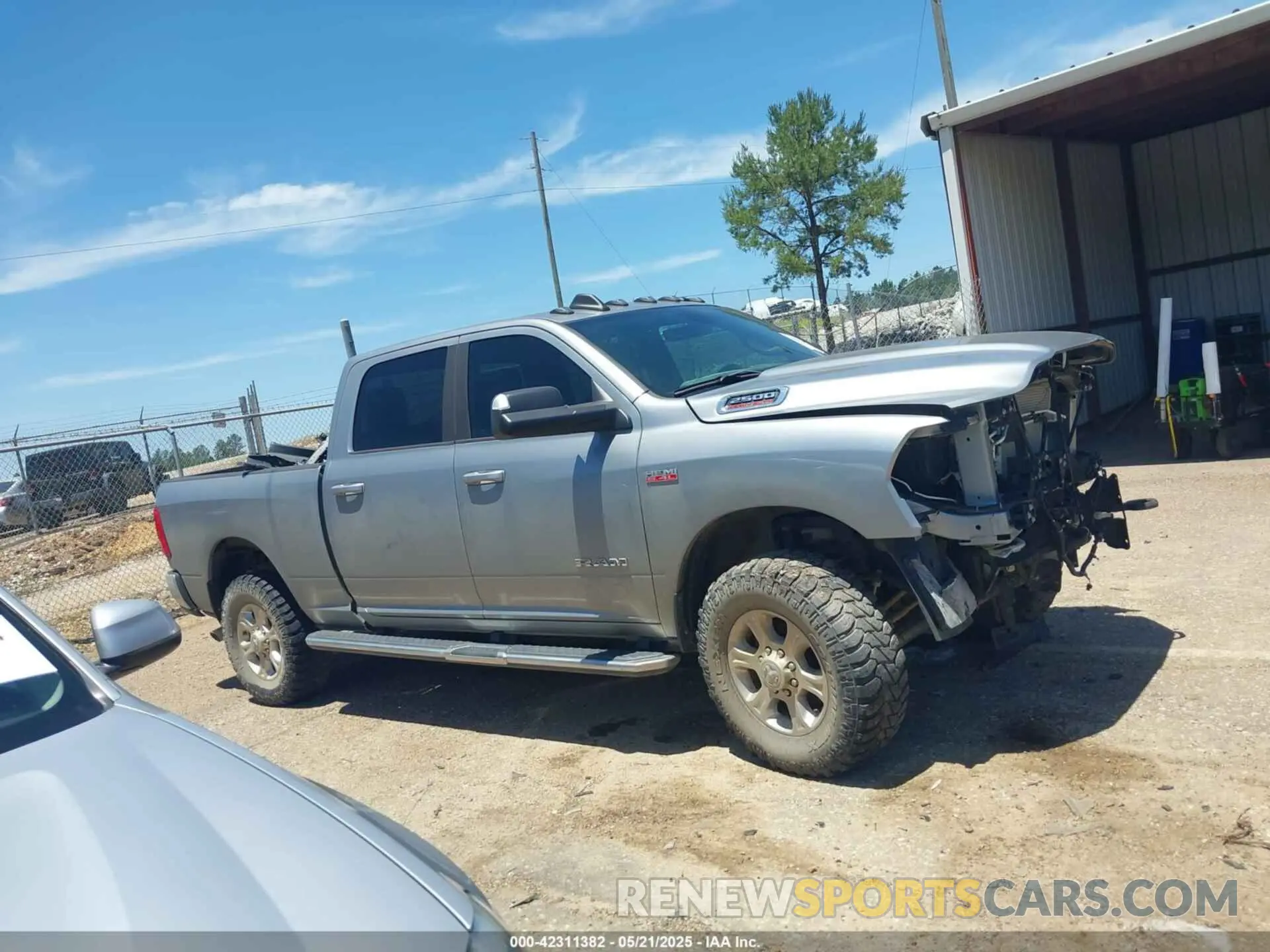 14 Photograph of a damaged car 3C6UR5DJ9MG590554 RAM 2500 2021