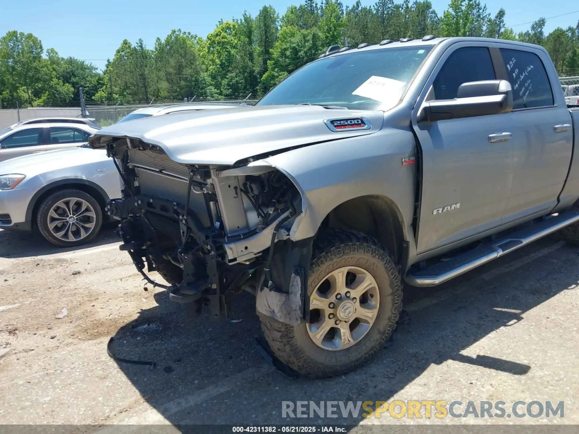 19 Photograph of a damaged car 3C6UR5DJ9MG590554 RAM 2500 2021