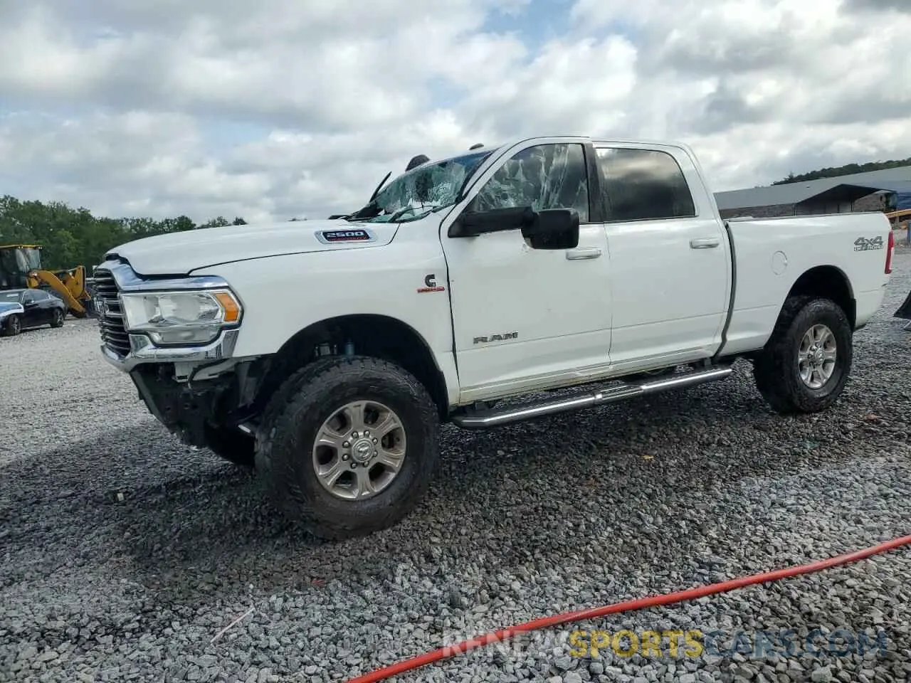 1 Photograph of a damaged car 3C6UR5DL0MG656149 RAM 2500 2021