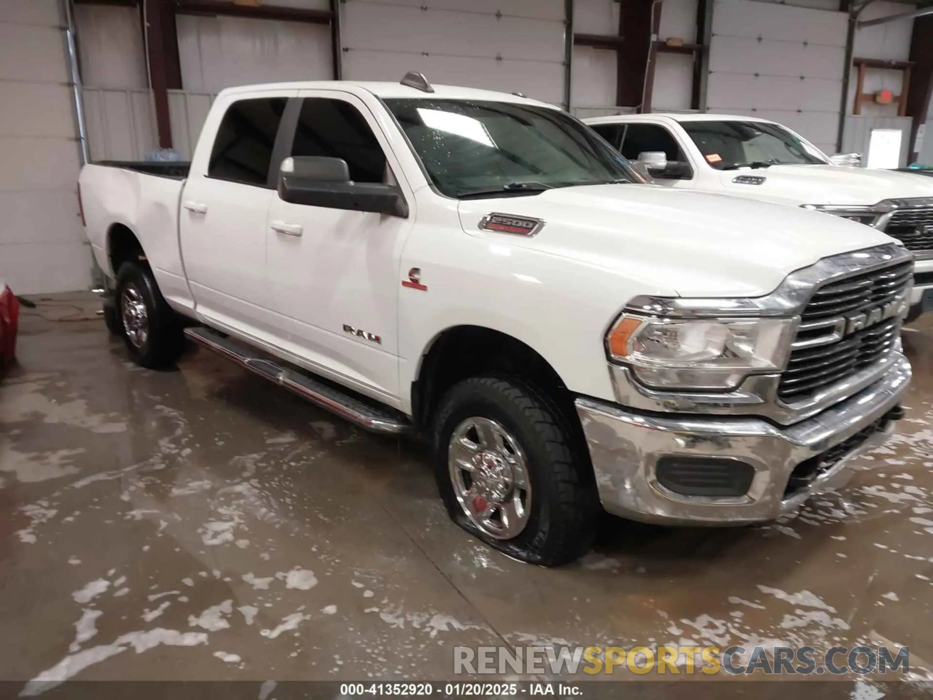 1 Photograph of a damaged car 3C6UR5DL1MG605601 RAM 2500 2021
