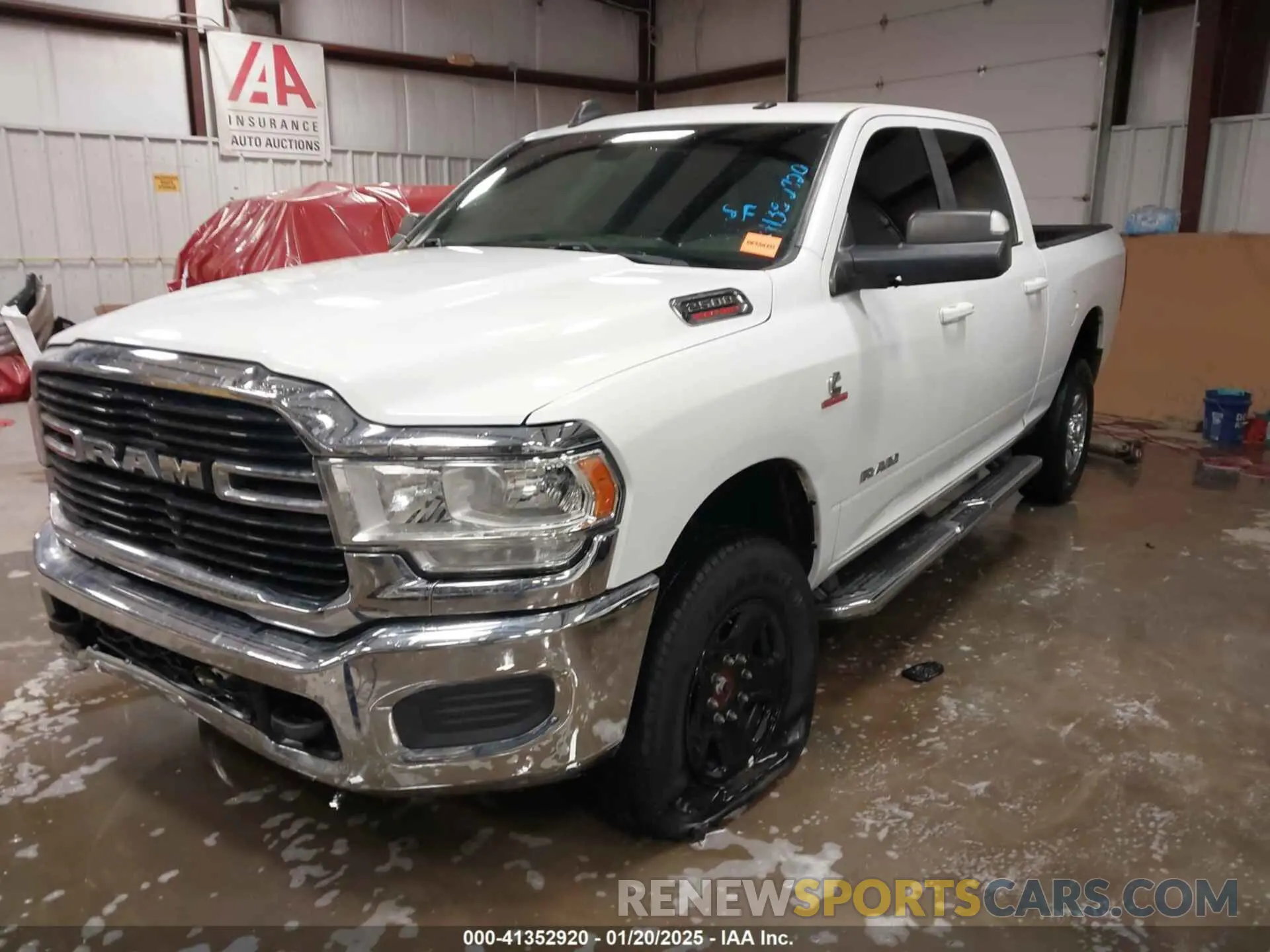 2 Photograph of a damaged car 3C6UR5DL1MG605601 RAM 2500 2021