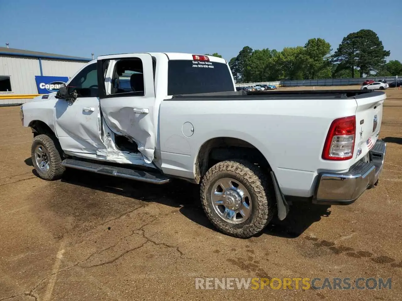 2 Photograph of a damaged car 3C6UR5DL2MG627980 RAM 2500 2021
