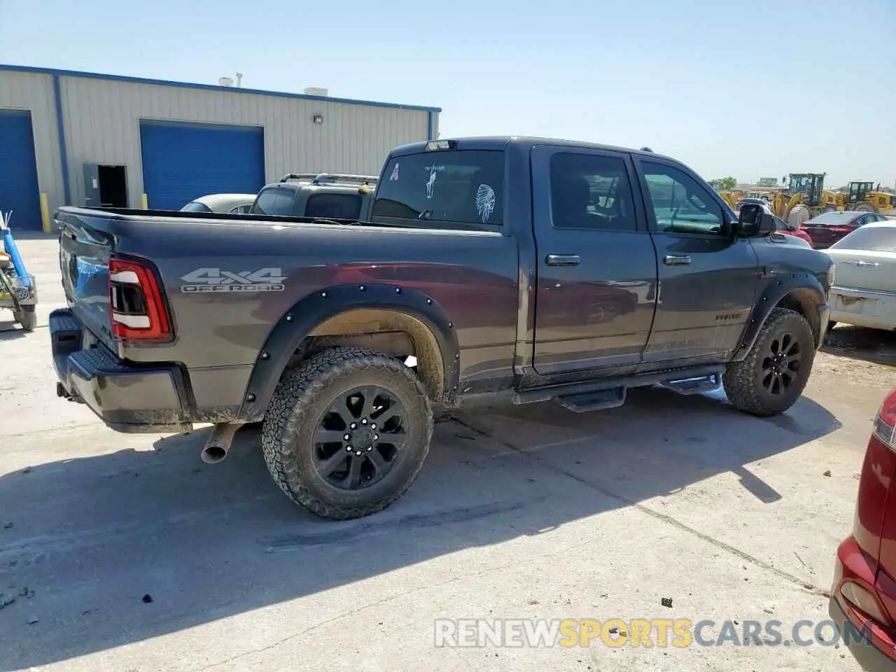 3 Photograph of a damaged car 3C6UR5DL3MG560774 RAM 2500 2021