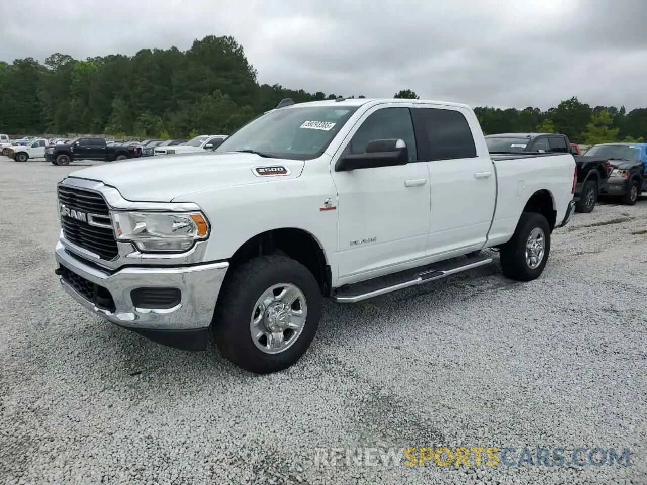 1 Photograph of a damaged car 3C6UR5DL3MG628653 RAM 2500 2021
