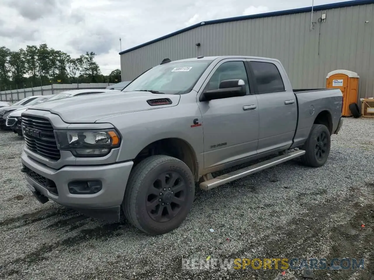 1 Photograph of a damaged car 3C6UR5DL3MG658395 RAM 2500 2021